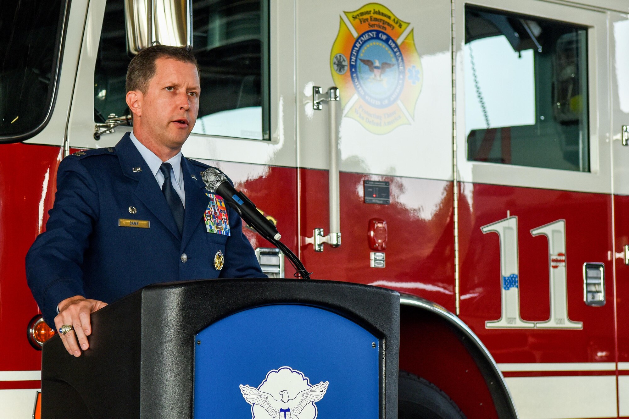 Col. Christopher Sage, 4th Fighter Wing commander, speaks during a 9/11 Remembrance ceremony, Sept. 11, 2016, at Seymour Johnson Air Force Base, North Carolina. Sage said the reason he is standing here today is because of the moment when the second plane hit the south tower and he put his plans to separate from the Air Force on the shelf. (U.S. Air Force photo by Airman Shawna L. Keyes)