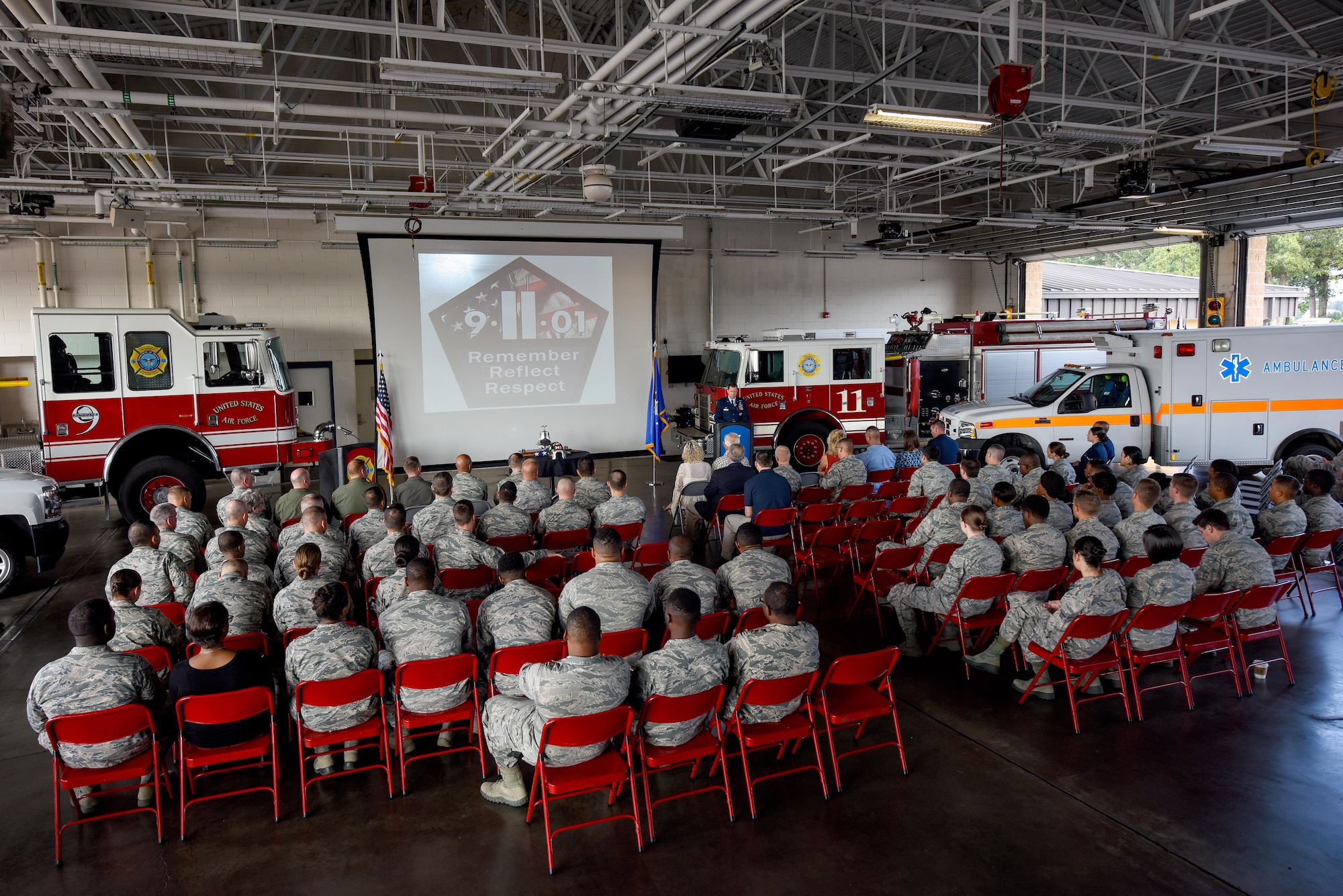 Members of Team Seymour attended a 9/11 Remembrance ceremony, Sept. 11, 2016, at Seymour Johnson Air Force Base, North Carolina. More than 150 base members attended the ceremony, which featured a slideshow of imagery, a 21-gun salute, a bell-ringing ceremony by Sean Quinby, 4th Civil Engineer Squadron fire chief, and special narrations regarding different events of 9/11. (U.S. Air Force photo by Airman Shawna L. Keyes)