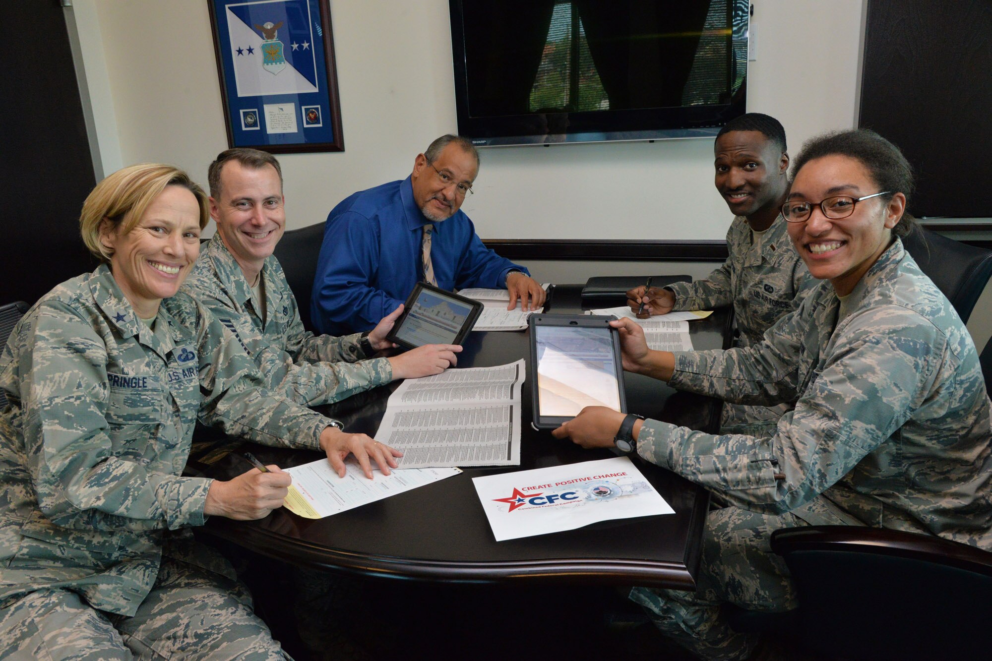 From left: Brig. Gen. Heather L. Pringle, 502nd Air Base Wing and Joint Base San Antonio commander; Chief Master Sgt. Brion Blais, 502nd ABW and JBSA command chief; Felipe Jimenez, 502nd ABW and JBSA technical director; 2nd Lt. Mark Thompson, installation Combined Federal Campaign project officer; and 2nd Lt. Avery Larkin, wing staff agency CFC project officer, plan donations for the 2016 CFC season Sept. 8 at JBSA-Fort Sam Houston.