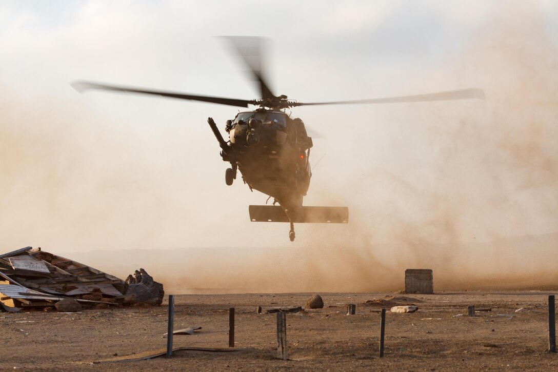 A Special Operations Command South assigned U.S. Army UH-60 Blackhawk rehearses landing techniques July 21, 2016 in Antofagasta, Chile. More than 100 SOCSOUTH service members participated in a Chilean bilateral training exchange, known as Estrella Austral in Spanish, to develop skills and increase interoperability between the forces to better respond to regional security challenges. (U.S. Army Photo by Staff Sgt. Osvaldo Equite/Released)