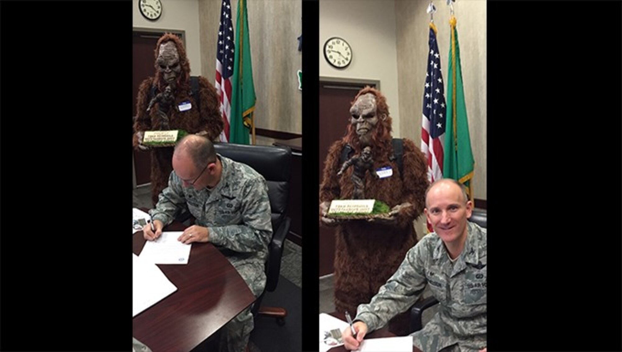 Col Ryan Samuelson, 92nd Air Refueling Wing commander, signs the Fairchild Air Force Base National 
Preparedness Month’s proclamation as the 92nd Civil Engineer Squadron Emergency Management mascot holds the Team Fairchild Outstanding Unit Trophy. The trophy that will be presented to the winning team at the conclusion of the Amazing Zombie Race on Sept. 22, 2016 at Miller Park. (U.S. Air Force photo/Master Sgt. Shannon L. Lynch)