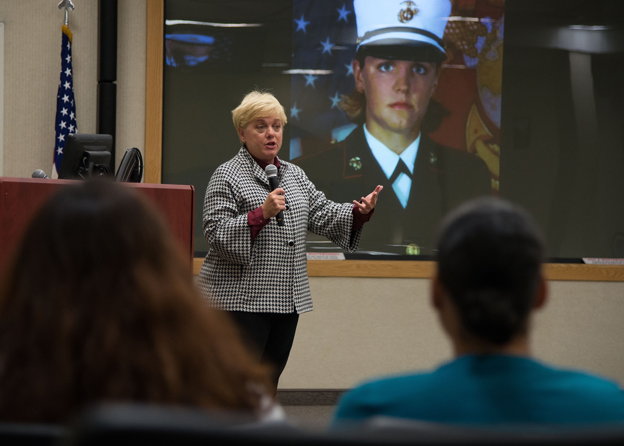 Mary Lauterbach, the mother of U.S. Marine Lance Cpl. Maria Lauterbach, speaks to base personnel about her daughter's death during a presentation at the Hanscom Conference Center Sept. 14. Her presentation, The Story of a Mother's Loss to Sexual Assault, told her daughter's story and how it helped to launch the Defense Department’s Expedited Transfer Program where survivors are afforded the opportunity to quickly relocate. (U.S. Air Force photo by Mark Herlihy)