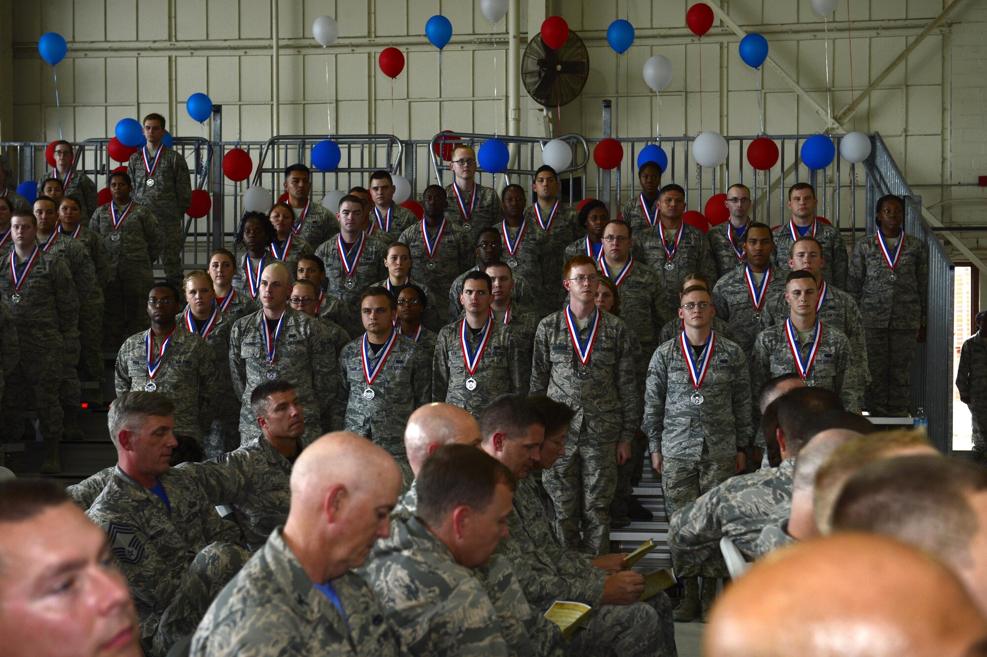 A group of newly inducted U.S. Air Force staff sergeant selects stand for the reading of the NCO creed at the NCO induction ceremony at Langley Air Force Base, Va., Sept. 9, 2016. Langley’s Club 5/6 hosted the installation’s first ever NCO induction ceremony and transition course following the release of the promotion selection list in Aug. 2016. (U.S. Air Force photo by Airman 1st Class Kaylee Dubois)