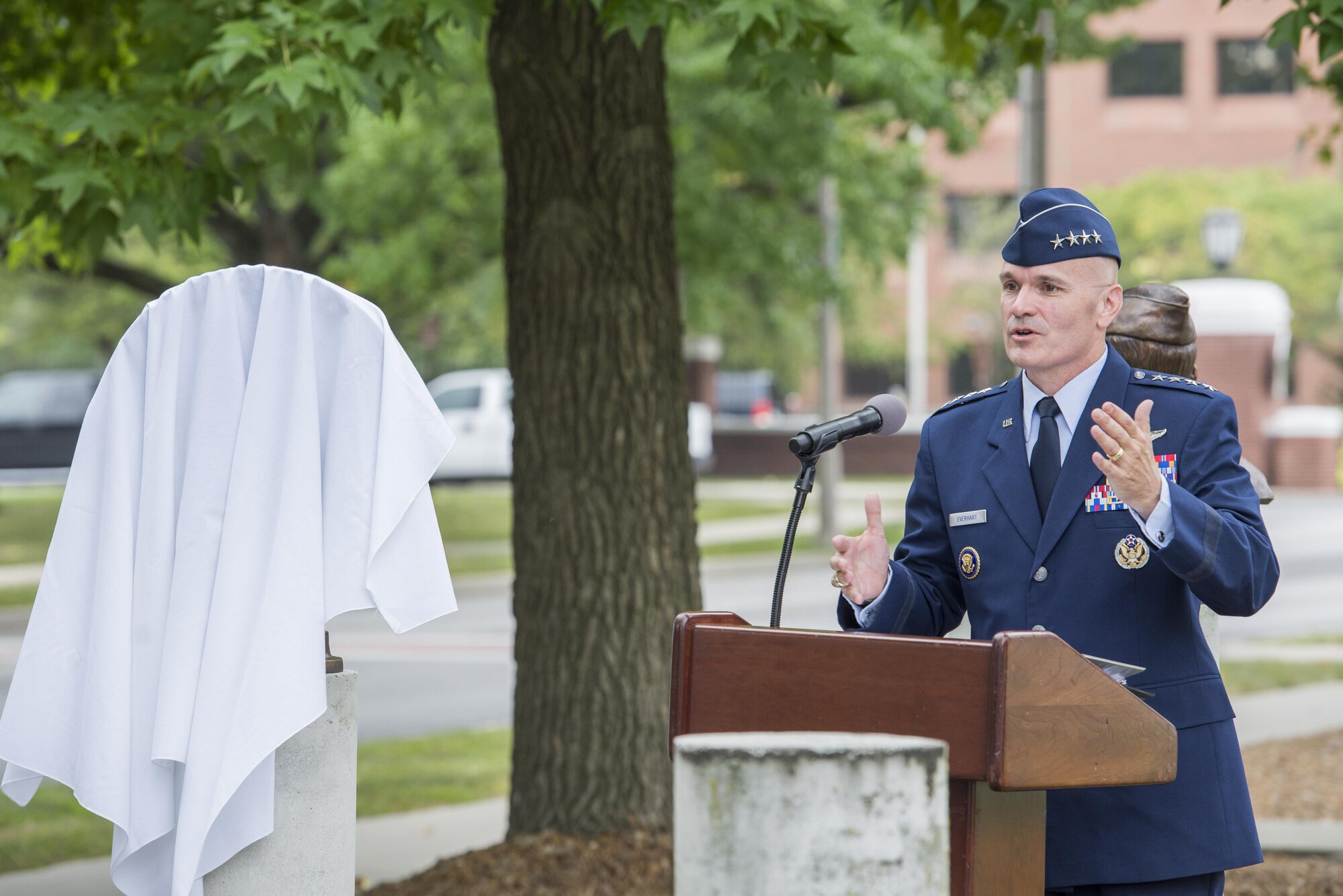 Gen. Carlton Everhart speaks at a bust dedication honoring the C-17A Pathfinder Loadmasters at Scott Air Force Base, Ill. Sept. 8, 2016. The C-17A Pathfinder loadmasters were being recognized for their efforts in providing the leadership and expertise necessary to guide Mcdonnell Douglas and Military Airlift Command to produce the C-17 Globemaster III. (U.S. Force Photo by Airman Daniel Garcia)