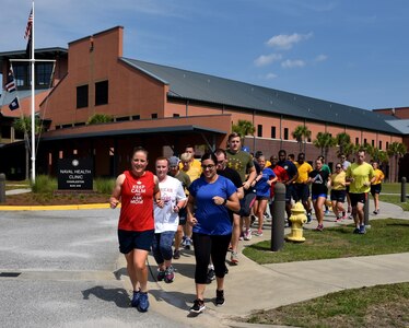 Naval Health Clinic Charleston staff members begin the first stretch of NHCC's 9/11 Memorial Run/Walk at NHCC Sept. 9 in honor of the fallen heroes of the 9/11 terrorists attacks 15 years ago.
