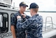 Aviation Boatswain's Mate (Fuels) Second Class Curtis Clausen receives the Navy Small Craft Insignia from Capt Robert Hudson, Deputy Joint Base Charleston commander, at an awards ceremony September 1. Claussen is assigned to a Harbor Patrol Unit (HPU) boat embedded in 628th Security Forces Squadron at Joint Base Charleston.