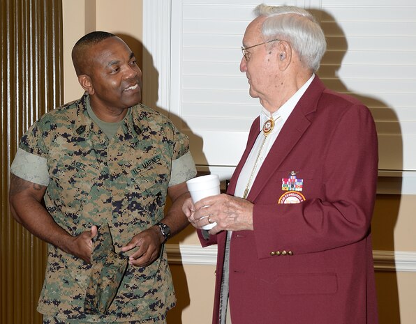 Sergeant Major Kenneth Agee, base sergeant major, MCLB Albany, greets Retired Army Col. Quin Herlik, guest of honor for the POW/MIA Recognition Breakfast, Sept. 9.