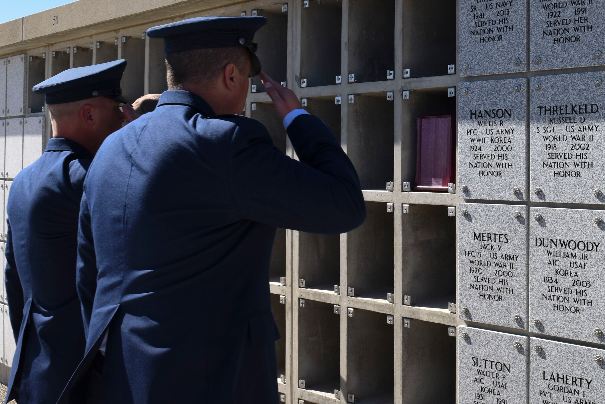 Chief Master Sgt. Will Armagost (left), 92nd Medical group superintendent, and Col. Matthew Fritz (right), 92nd ARW vice commander, salute after interring veterans remains Sept. 13, 2016, at Washington State Cemetery at Medical Lake, Washington. The purpose of the Missing In America Project is to locate, identify and inter the unclaimed remains of American veterans through the joint efforts of private, state and federal organizations. To provide honor and respect to those who have served this country by securing a final resting place for these forgotten heroes. (U.S. Air Force photo/Senior Airman Nick J. Daniello)