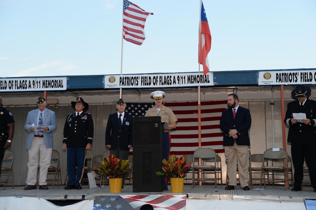 Maj. Stephen Lacovara, program manager, Logistics Capabilities Center, Marine Corps Logistics Command, was one of several guests that included local leaders, first responders and active-duty military, participating in the 15th annual Patriot's Field of Flags, Sept. 10. The 9/11 program has been organized by the American Legion Post 30 every year since the Sept. 11, 2001 terrorist attacks to remember those who were killed and injured and to celebrate the heroic response to those attacks. Lacovara read the names of every Georgian who has died in military service since 9/11.

