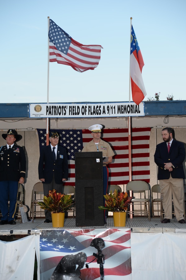 Maj. Stephen Lacovara, program manager, Logistics Capabilities Center, Marine Corps Logistics Command, was one of several guests that included local leaders, first responders and active-duty military, participating in the 15th annual Patriot's Field of Flags, Sept. 10. The 9/11 program has been organized by the American Legion Post 30 every year since the Sept. 11, 2001 terrorist attacks to remember those who were killed and injured and to celebrate the heroic response to those attacks. Lacovara read the names of every Georgian who has died in military service since 9/11.

