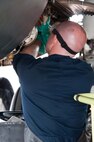 U.S. Air Force Senior Airman Michael Cameron, 7th Bomb Wing hydraulics systems specialist, performs an inspection on the B-1B Lancer at Royal Air Force Base Fairford, England, Sept. 8, 2016.  Cameron is deployed to RAF Fairford to participate in Exercise Ample Strike, a Czech Republic led, 18 nation live exercise. (U.S. Air Force photo by 1st Lt. Monique Roux/Released)