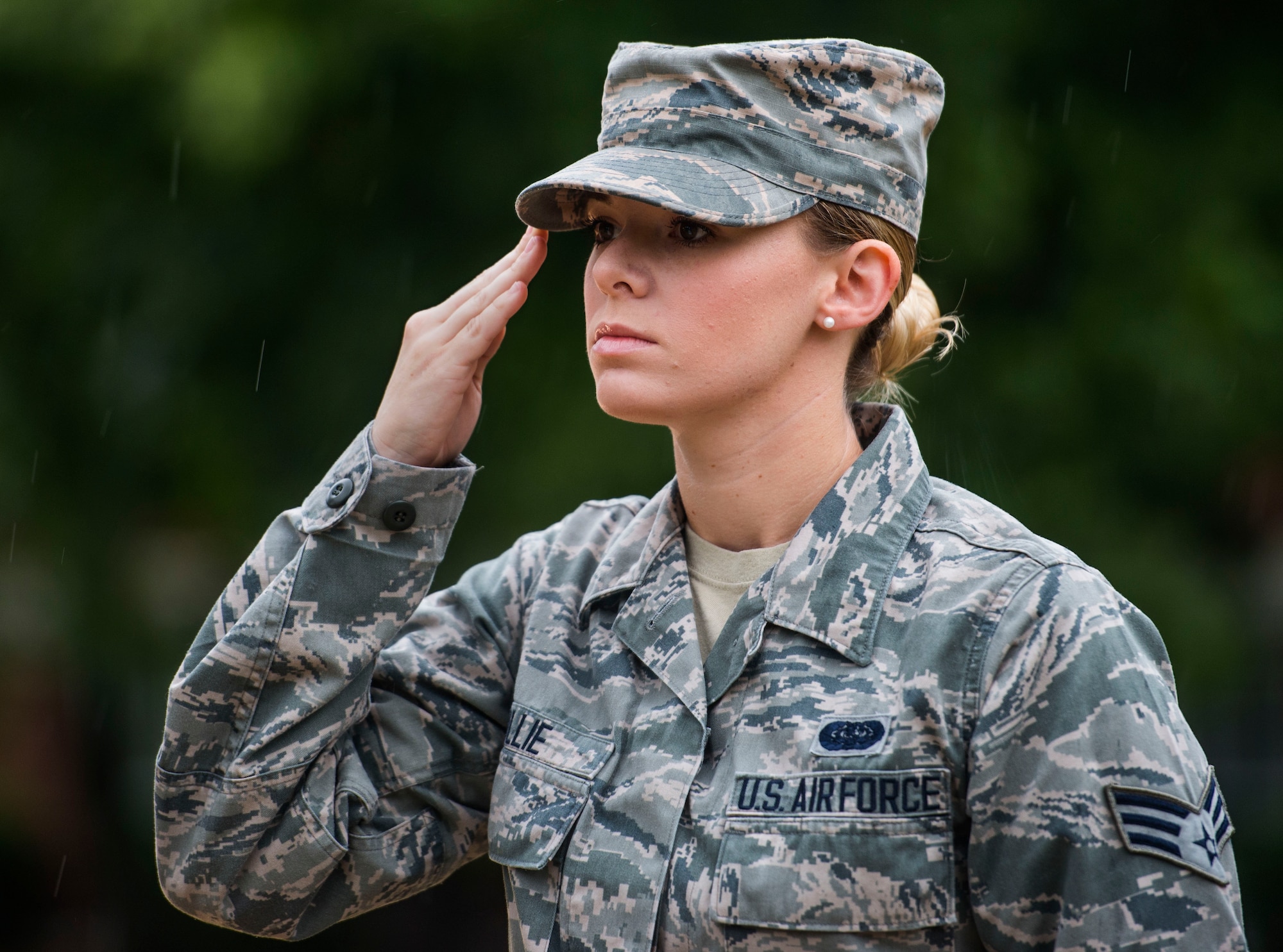 Senior Airman Class Rachel Ollie, 375th Communications Squadron, salutes the flag after it was lowered to half-mast in honor of Patriot Day, Scott Air Force Base, Ill., Sept. 9, 2016. (U.S. Air Force photo/Staff Sgt. Jodi Martinez)