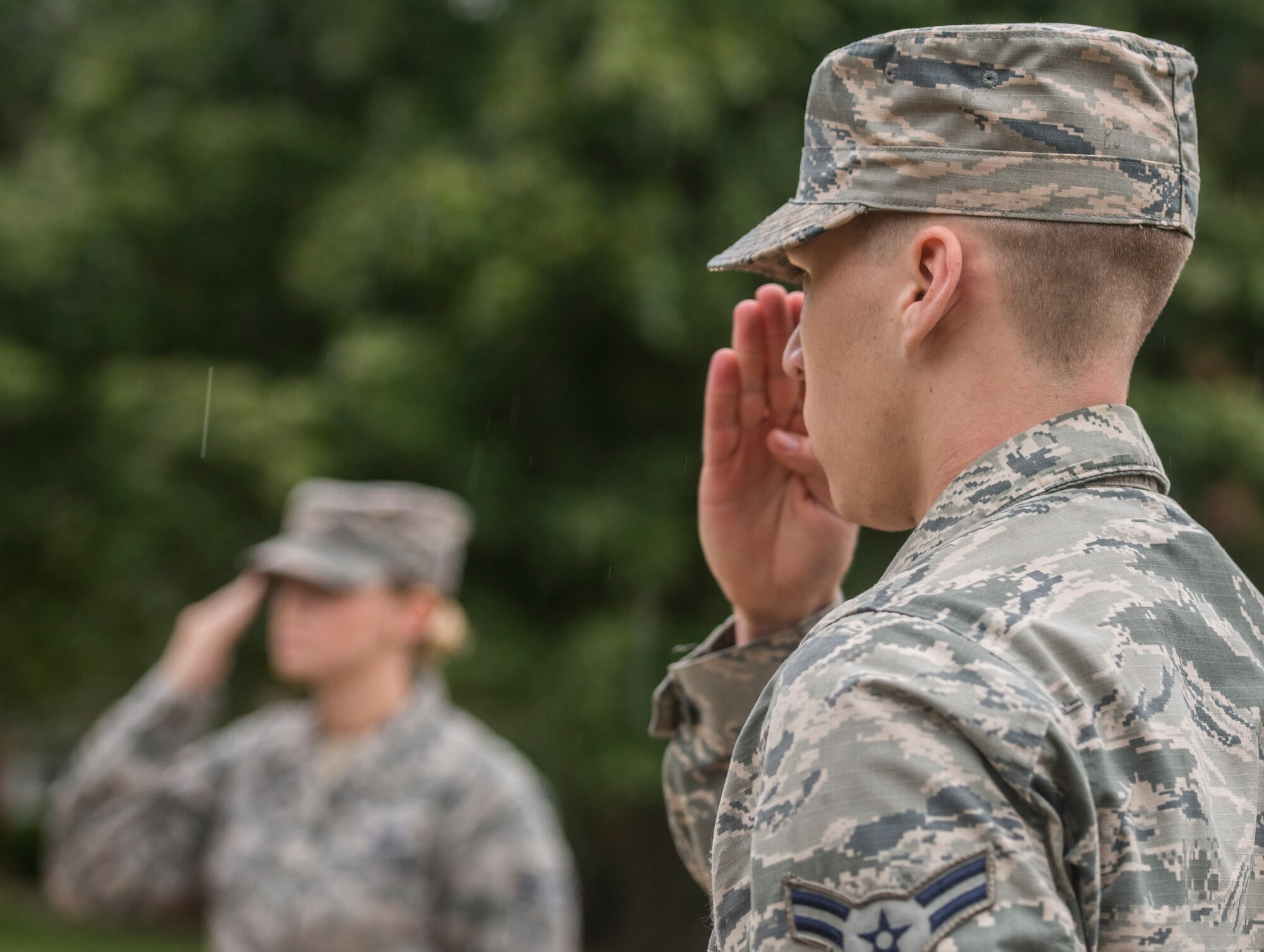 Airman 1st Class Adam Dann, 375th Communications Squadron, salutes the flag after it was lowered to half-mast in honor of Patriot Day, Scott Air Force Base, Ill., Sept. 9, 2016. (U.S. Air Force photo/Staff Sgt. Jodi Martinez)