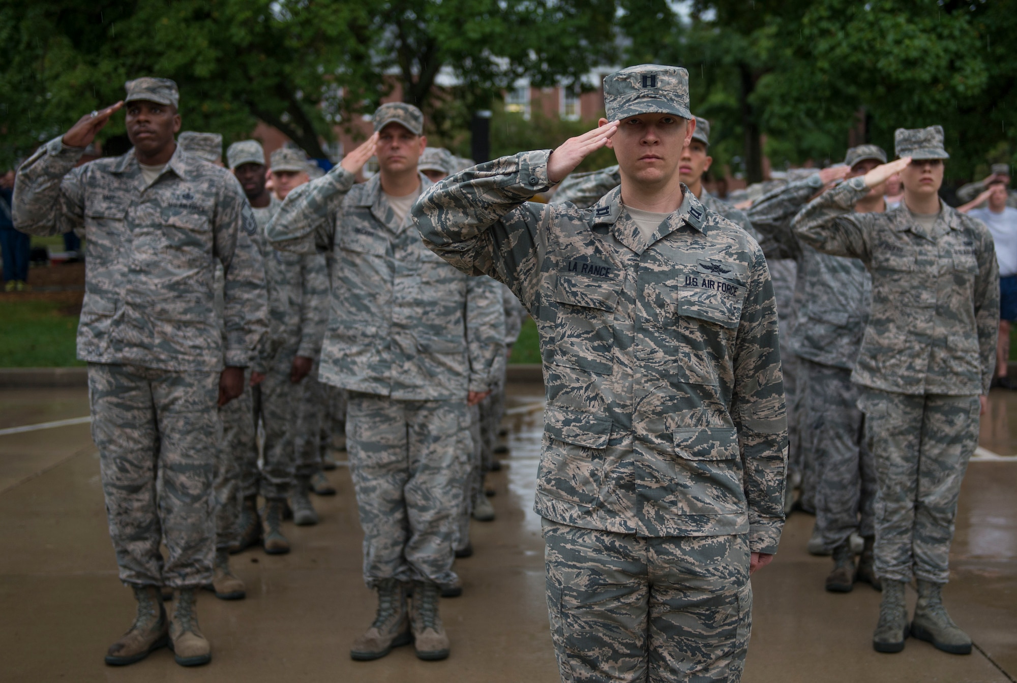 Members of Scott Air Force Base salute as the American flag is brought to half-mast during Reveille, Scott Air Force Base, Ill., Sept. 9, 2016.  (U.S. Air Force photo by Staff Sgt. Jodi Martinez)