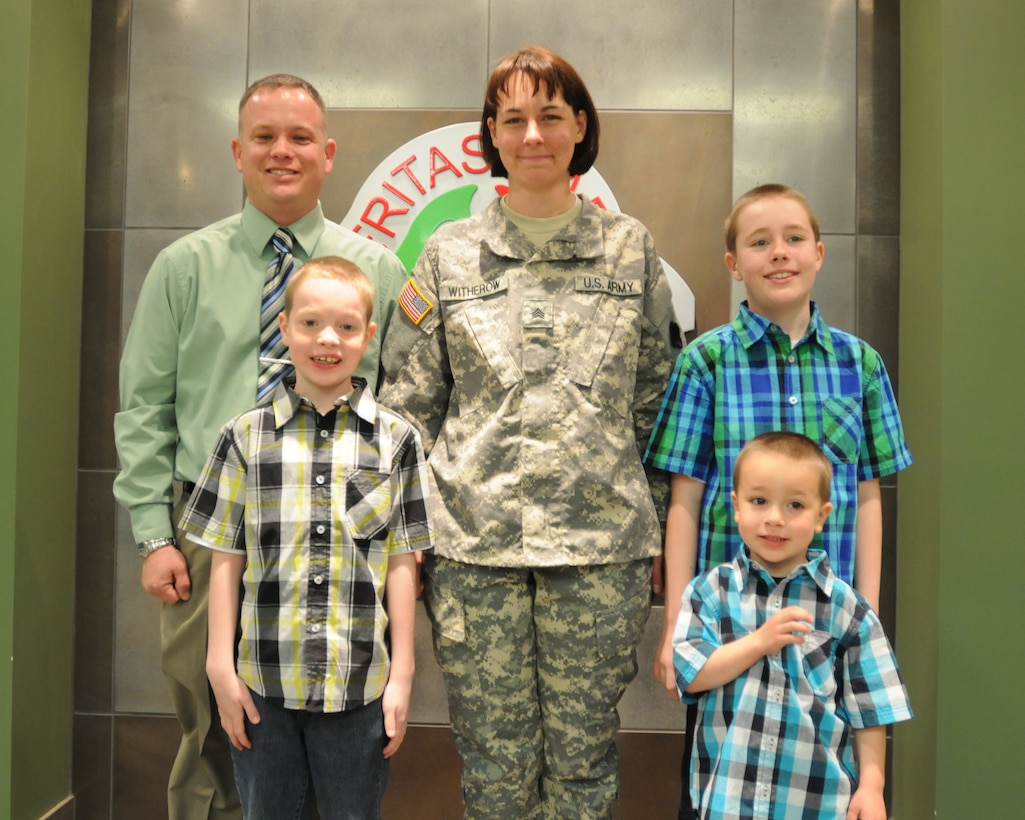 Sgt. Rachelle Witherow and her family pose for a photo after her promotion ceremony at the 88th RSC Headquarters on Fort McCoy, Wis., April 3, 2015. (U.S. Army Reserve photo courtesy of Sgt. 1st Class Corey Beal)