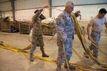 Members of the Aircraft Flight Equipment team work together to untangle the 48 lines of a parachute used to slow a B52H Stratofortess after landing at Royal Air Force Fairford during Exercise Ample Strike 2016.  The team is assigned to the 307th Bomb Wing, Barksdale Air Force Base, La. and deployed to RAF Fairford to participate in Exercise Ample Strike, a Czech Republic led, 18 nation live exercise. (U.S. Air Force photo by 1st Lt. Monique Roux/Released)