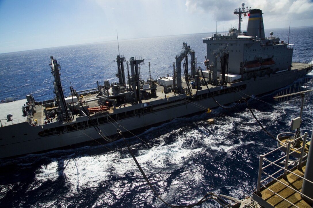 AT SEA -- The USS Bonhomme Richard (LHD-6) refuels and receives supplies during a replenishment at sea in the Pacific Ocean, Sept. 12, 2016. During replenishments at sea, Navy MH-60S Seahawk helicopters ferry food and supplies from Navy supply ships to the ships of the Bonhomme Richard Expeditionary Strike Group. The 31st MEU is the Marine Corps’ only continuously forward-deployed Marine Air-Ground Task Force, and combines air-ground-logistics into a single team capable of addressing a range of military operations in the Asia-Pacific region – from force protection and maritime security to humanitarian assistance and disaster relief in cooperation with host countries and partner militaries.