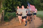 Staff Sgt. Mark A. Bunkley (center), 350th Battlefield Airman Training Squadron tactical air control party instructor, leads a group of 350th BA TS trainees during the 9/11
Commemorative Run Sept. 6, 2016, at Joint Base San Antonio-Lackland Medina Annex, Texas.
