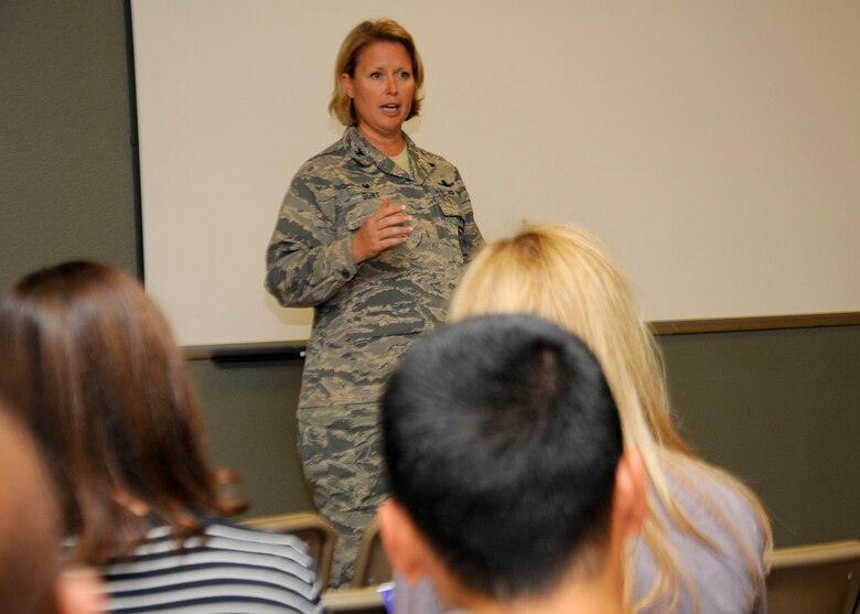 SCHRIEVER AIR FORCE BASE, Colo.-- Col. DeAnna Burt, 50th Space Wing commander presents her opening remarks during the Falcon Ridge townhall, Sept. 12, 2016, Schriever Air Force Base, Colo. The town hall was hosted again based off of the success and feedback from the last town hall. The event updated the housing community on upcoming events around the base.(U.S. Air Force photo/Staff Sgt. Matthew Coleman-Foster)