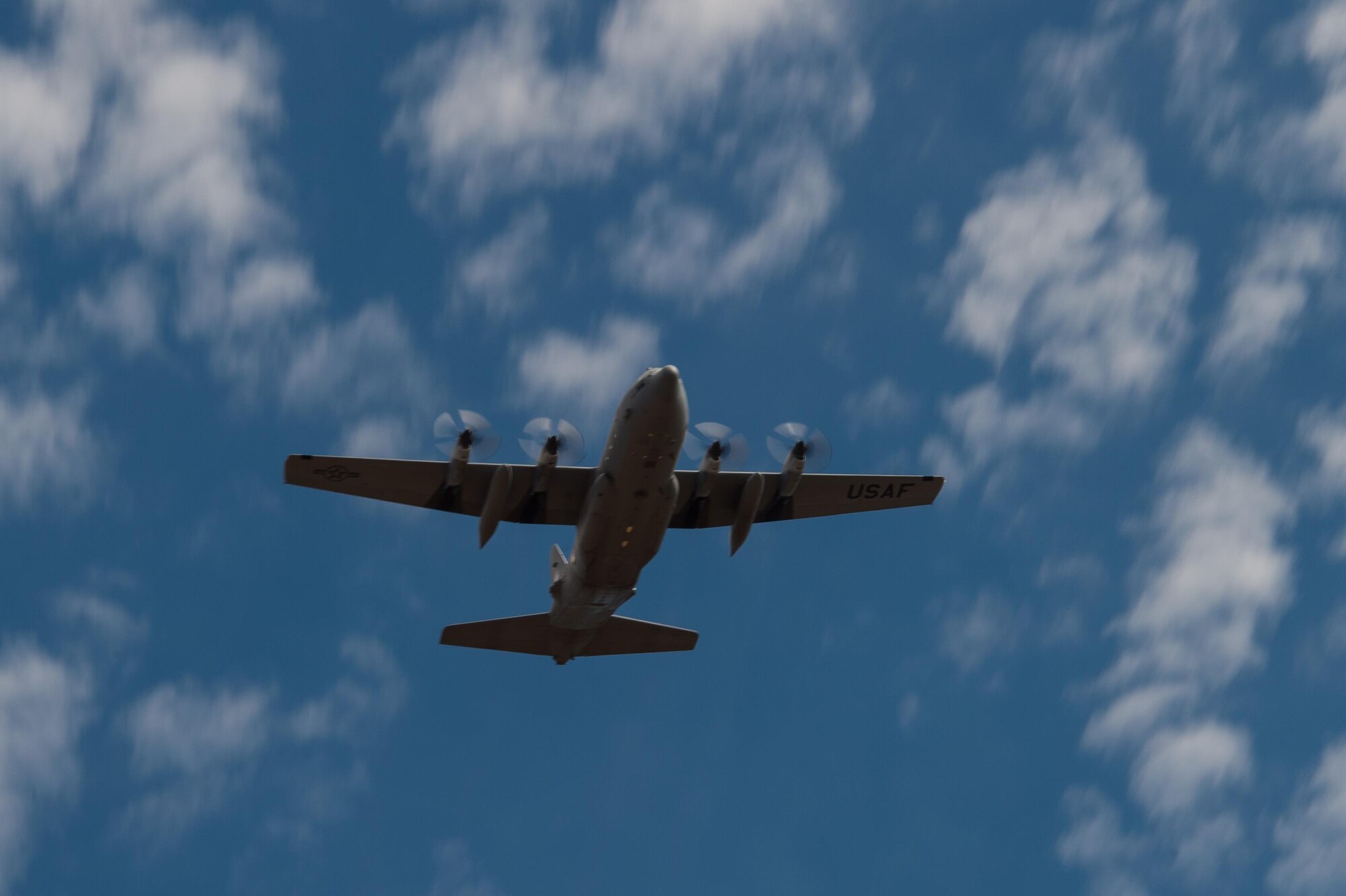 An Illinois Air National Guard C-130 Hercules aircraft flies over the Red Devil Landing Zone during Exercise Cerberus Strike 16-02 on Fort Carson, Colorado, Sept. 12, 2016. C-Strike is a joint exercise where contingency response forces rehearse potential real-world situations by training with Army counterparts in cargo uploading and downloading on aircraft, aircraft engine running off-loads, communications, aerial port procedures, and air mobility liaison officer operations with airdrops from aircraft. (U.S. Air Force photo by Master Sgt. Joseph Swafford)