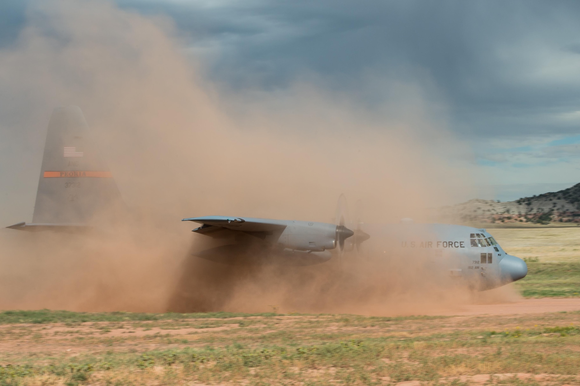 An Illinois Air National Guard C-130 Hercules aircraft lands at the Red Devil Landing Zone during Exercise Cerberus Strike 16-02 on Fort Carson, Colorado, Sept. 12, 2016. C-Strike is a joint exercise where contingency response forces rehearse potential real-world situations by training with Army counterparts in cargo uploading and downloading on aircraft, aircraft engine running off-loads, communications, aerial port procedures, and air mobility liaison officer operations with airdrops from aircraft. (U.S. Air Force photo by Master Sgt. Joseph Swafford)
