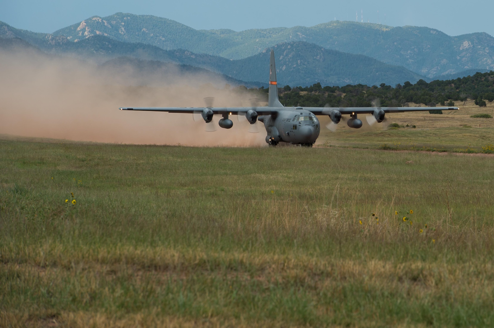 An Illinois Air National Guard C-130 Hercules aircraft lands at the Red Devil Landing Zone during Exercise Cerberus Strike 16-02 on Fort Carson, Colorado, Sept. 12, 2016. C-Strike is a joint exercise where contingency response forces rehearse potential real-world situations by training with Army counterparts in cargo uploading and downloading on aircraft, aircraft engine running off-loads, communications, aerial port procedures, and air mobility liaison officer operations with airdrops from aircraft. (U.S. Air Force photo by Master Sgt. Joseph Swafford)
