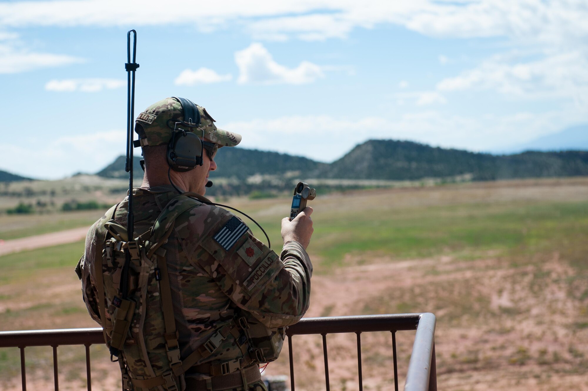 U.S. Air Force Maj. John Fuccillo, an air mobility liaison officer with the 621st Mobility Support Operations Squadron assigned to the U.S. Army's 4th Infantry Division at Fort Carson, Colorado, takes a wind reading during Cerberus Strike 16-02 at the Red Devil Landing Zone, Colorado, Sept. 12, 2016. C-Strike is a joint exercise where contingency response forces rehearse potential real-world situations by training with Army counterparts in cargo uploading and downloading on aircraft, aircraft engine running off-loads, communications, aerial port procedures, and air mobility liaison officer operations with airdrops from aircraft. (U.S. Air Force photo by Master Sgt. Joseph Swafford)