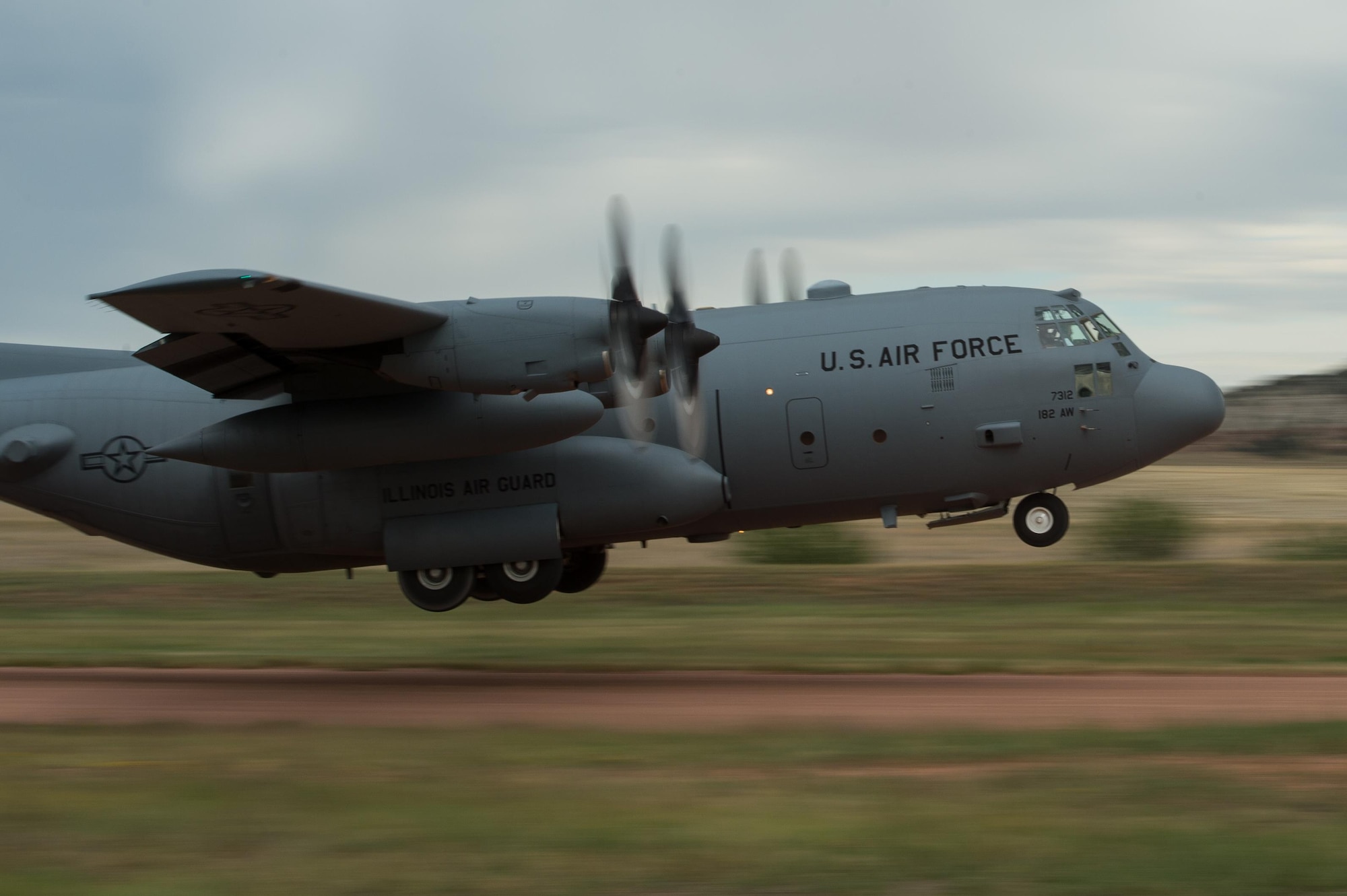 An Illinois Air National Guard C-130 Hercules aircraft takes off from the Red Devil Landing Zone during Exercise Cerberus Strike 16-02 on Fort Carson, Colorado, Sept. 12, 2016. C-Strike is a joint exercise where contingency response forces rehearsed potential real-world situations by training with Army counterparts in cargo uploading and downloading on aircraft, aircraft engine running off-loads, communications, aerial port procedures, and air mobility liaison officer operations with airdrops from aircraft. (U.S. Air Force photo by Master Sgt. Joseph Swafford)
