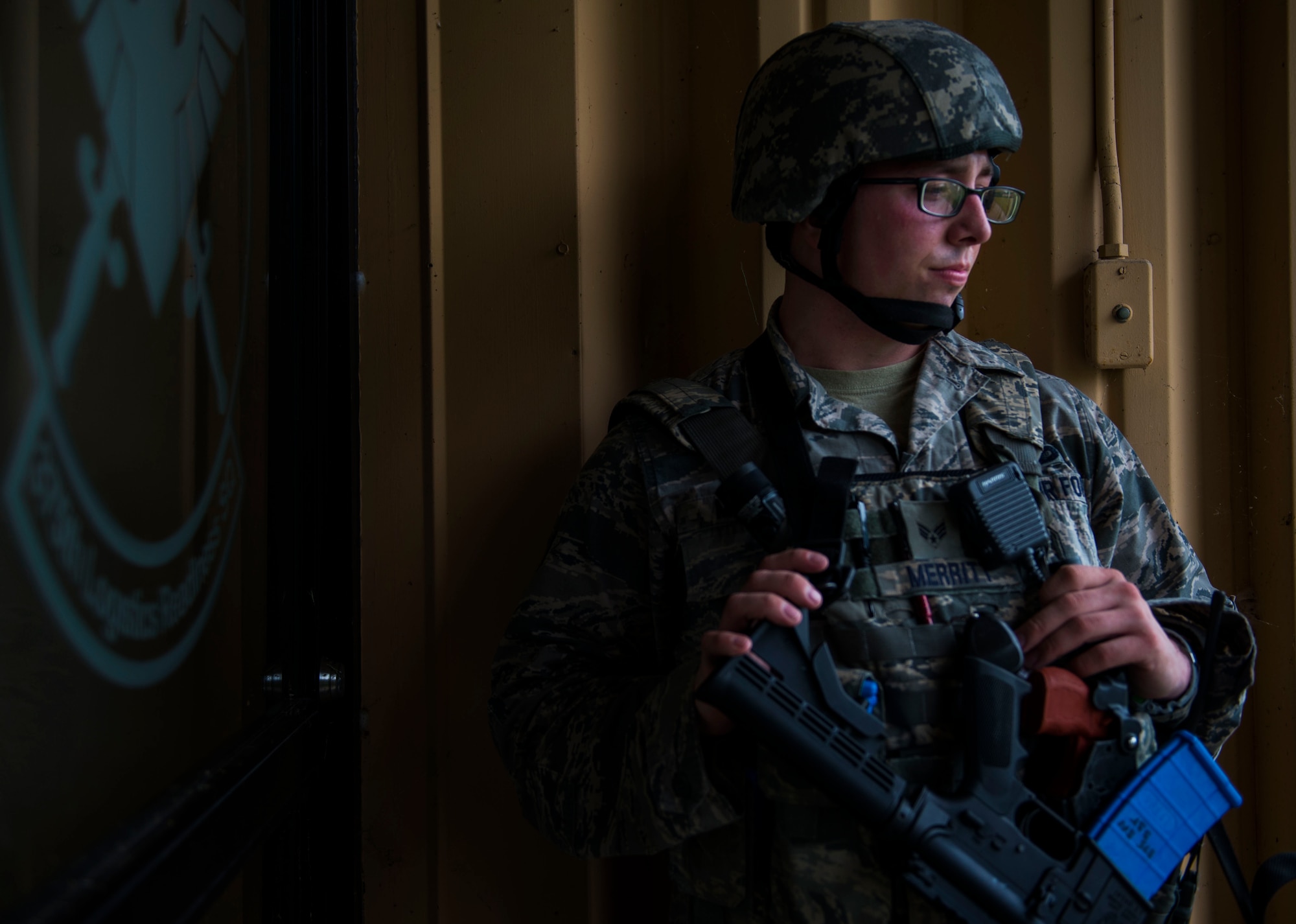Senior Airman Wade Merritt, 375th Security Forces Squadron, listens to a brief during an active shooter exercise, Scott Air Force Base, Ill., Sept. 9, 2016.  With an increase of mass shootings, the Department of Defense has trained personnel and first responders on how to respond in an active shooter situation.