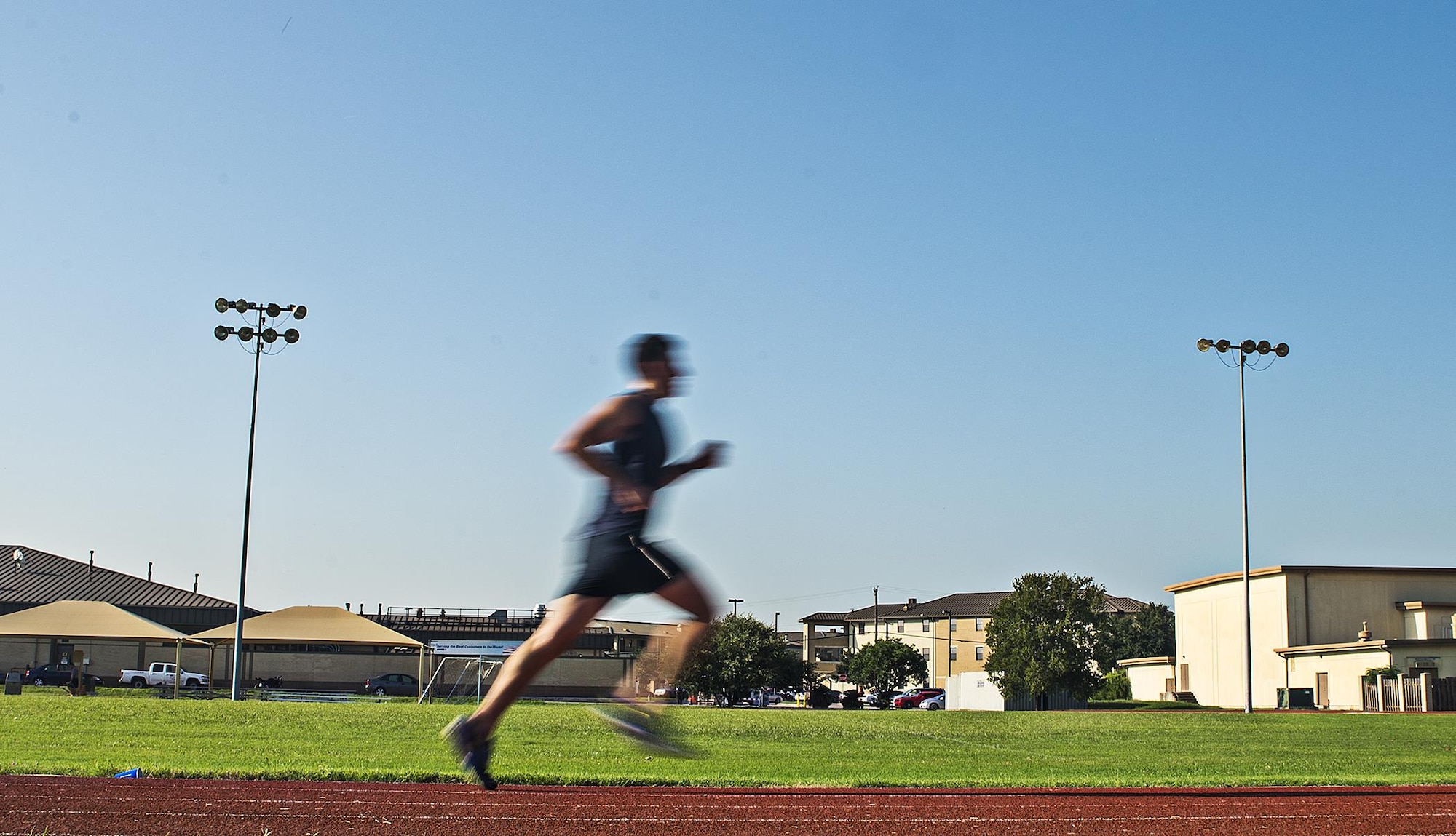 Master Sgt. Tito Carrillo, 433rd Aeromedical Evacuation Squadron flight medic, sprints down the straight away at the Warhawk track Sept. 1, 2016 at Joint Base San Antonio-Lackland, Texas. Carrillo was selected to run on the 2016 Air Force Reserve Command's Challenge Team. The team is comprised of 10 marathon runners who will compete with other Air Force major commands in the half and full marathon at the 20th annual Air Force Marathon Sept. 17, 2016 at Wright-Patterson Air Force Base, Ohio.  (U.S. Air Force photo by Benjamin Faske)
