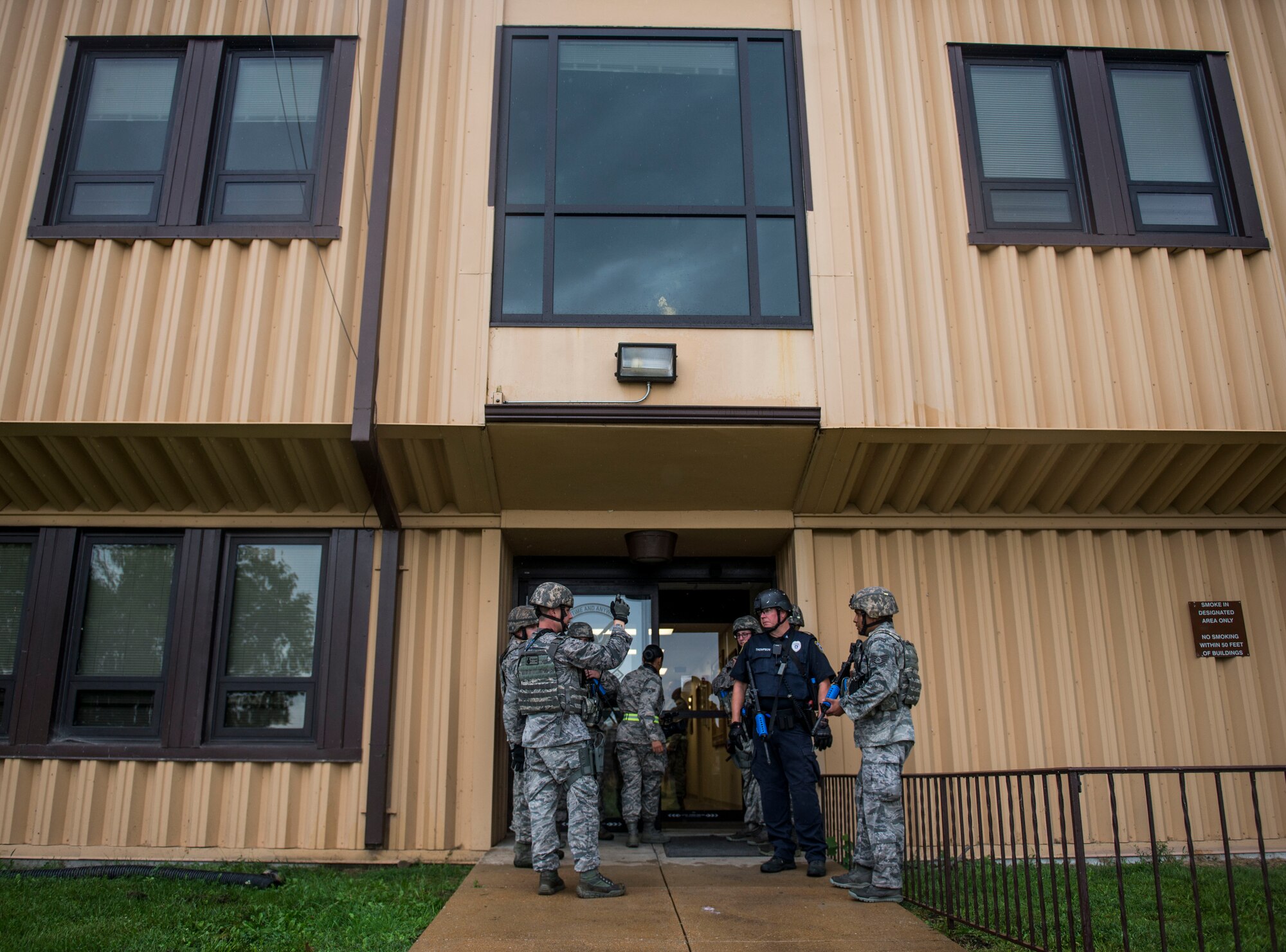 375th Security Forces Members discuss the current situation during an active shooter exercise, Scott Air Force Base, Ill., Sept. 9, 2016.  With an increase of mass shootings, the Department of Defense has trained personnel and first responders on how to respond in an active shooter situation.