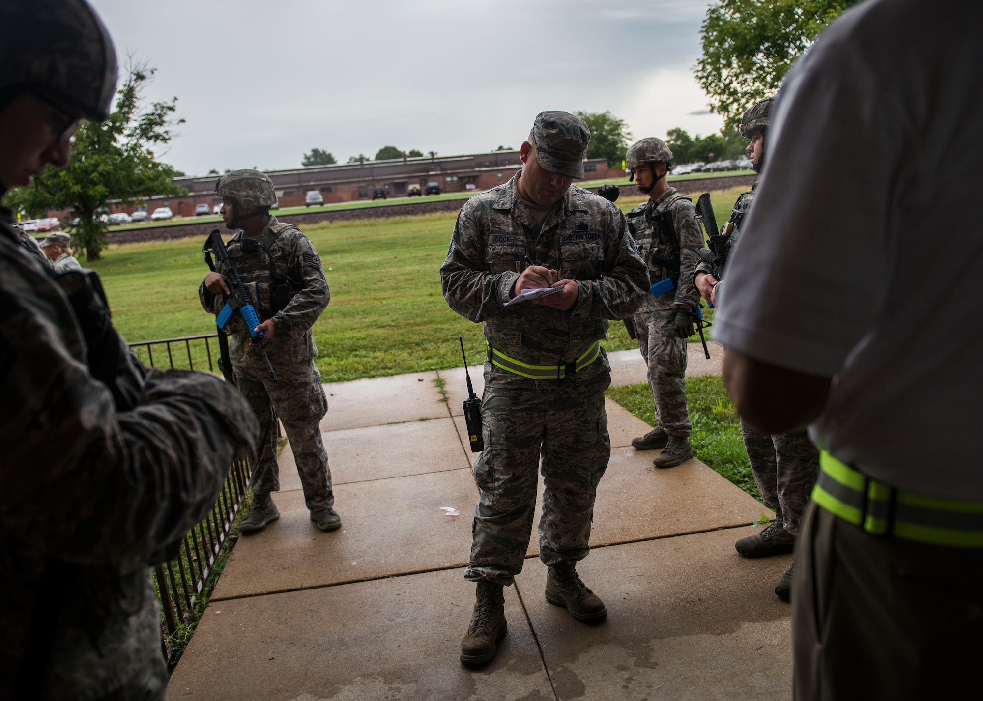 375th Security Forces Squadron members are briefed by the inspector during an active shooter exercise Scott Air Force Base, Ill., Sept. 9, 2016.  With an increase of mass shootings, the Department of Defense has trained personnel and first responders on how to respond in an active shooter situation.