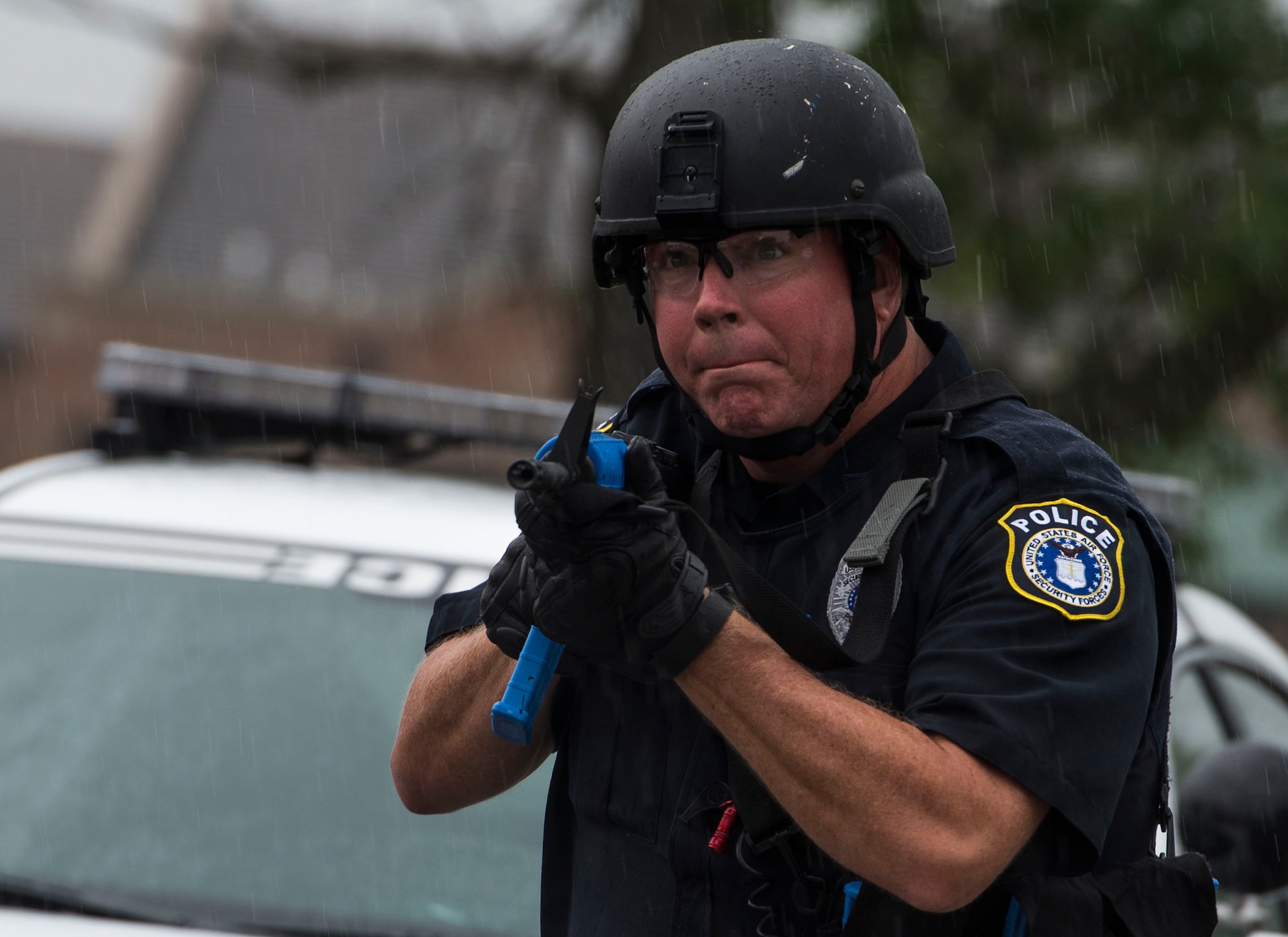 Patrick Thompson, 375th Security Forces Squadron, charges toward a building with an active shooter situation inside, Scott Air Force Base, Ill., Sept. 9, 2016.  With an increase of mass shootings, the Department of Defense has trained personnel and first responders on how to respond in an active shooter situation.