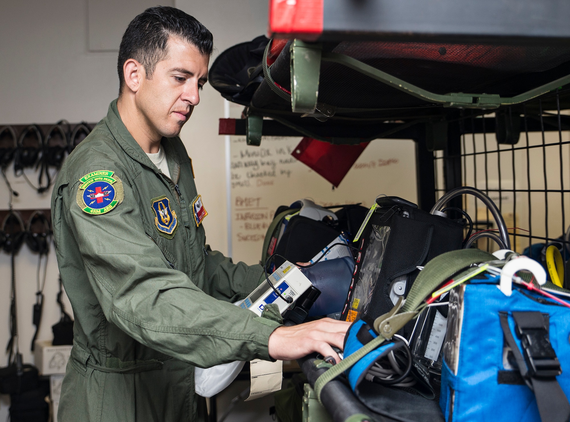 Master Sgt. Tito Carrillo, 433rd Aeromedical Evacuation Squadron flight medic, performs an inventory check on medical equipment Sept. 2, 2016 at Joint Base San Antonio-Lackland, Texas. The team is comprised of 10 marathon runners who will compete with other Air Force major commands in the half and full marathon at the 20th annual Air Force Marathon Sept. 17, 2016 at Wright-Patterson Air Force Base, Ohio. (U.S. Air Force photo by Benjamin Faske)