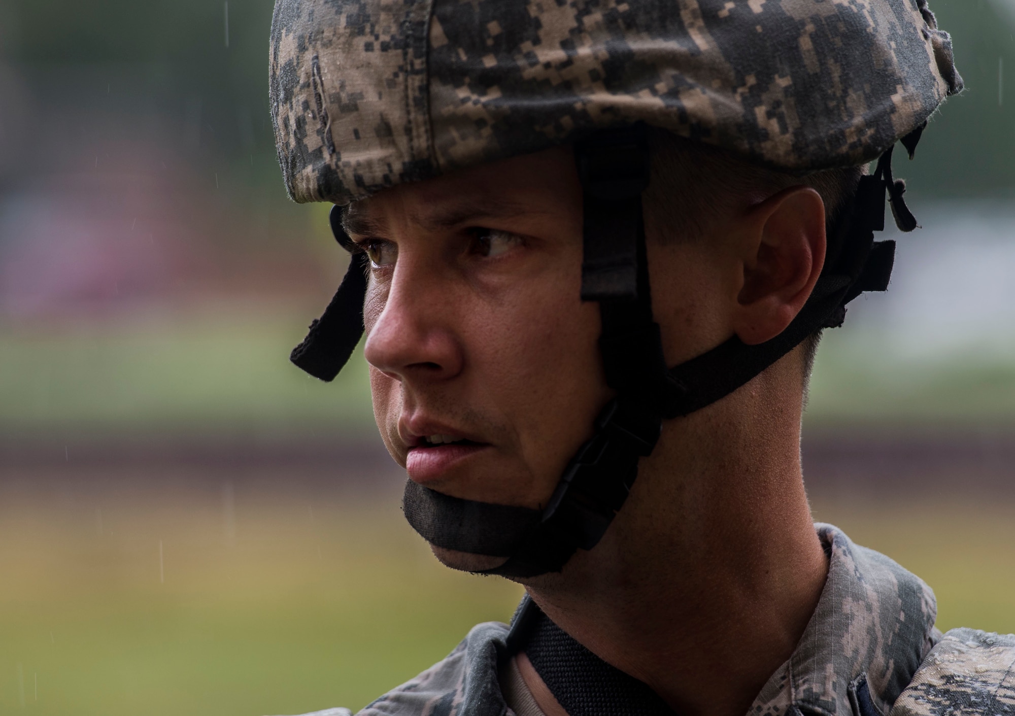 1st Lt. Paul Kilquist, 375th Security Forces Squadron, listens to updates on an active shooter exercise in the rain, Scott Air Force Base, Ill., Sept. 9, 2016.  With an increase of mass shootings, the Department of Defense has trained personnel and first responders on how to respond in an active shooter situation.