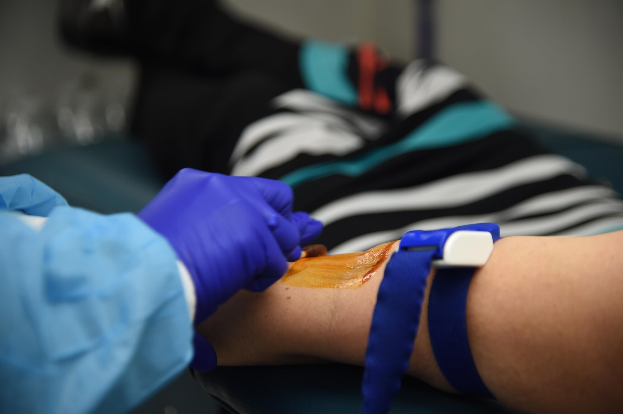 A phlebotomy technician applies betadine during a blood drive at Joint Base Elmendorf-Richardson, Alaska, Sept. 14, 2016. One pint of blood can save up to three lives.