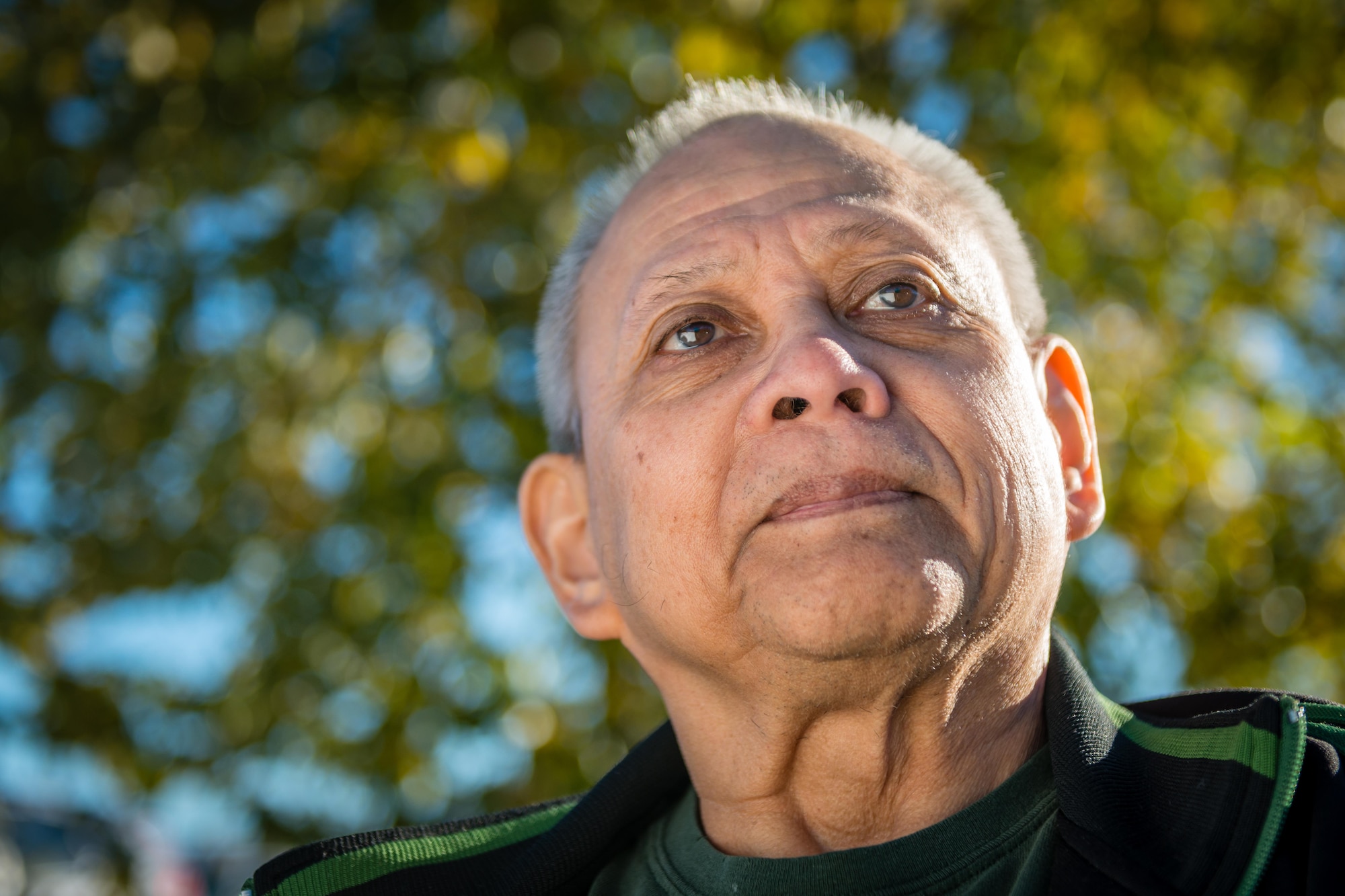 Jonathan Dalsfoist, 673d Civil Engineer Squadron mechanical engineer, sits in front of a tree outside his office building on Joint Base Elmendorf-Richardson, Alaska. Over the course of his 45-year career, Dalsfoist has saved the Air Force many times his salary in energy savings and has recently been selected for the 2016 Federal Energy Management Program's Exceptional Career Award. 