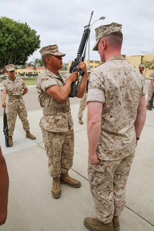 A recruit from Bravo Company, 1st Recruit Training Battalion, performs inspection arms during the Series Commander’s Inspection at Marine Corps Recruit Depot San Diego, Sept. 12. Recruits are given time to clean their rifles every day to keep them in proper working order. Annually, more than 17,000 males recruited from the Western Recruiting Region are trained at MCRD San Diego. Bravo Company is scheduled to graduate Oct. 14.