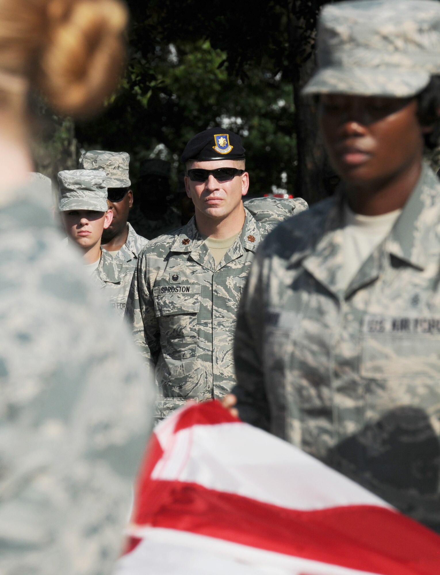 Maj. Devin Sproston, 81st Security Forces Squadron commander, stands at attention during a 9/11 memorial ceremony, Sept. 12, 2016, on Keesler Air Force Base, Miss. Fifteen years ago on Sept. 11, 2001, 19 terrorists simultaneously hijacked four passenger jets; flying one into the Pentagon in Washington, D.C., two into the World Trade Center in New York City, New York and one crashing outside of Shanksville, Pa. A total of 2,996 people were killed in the attacks.  (U.S. Air Force photo by Kemberly Groue/Released)