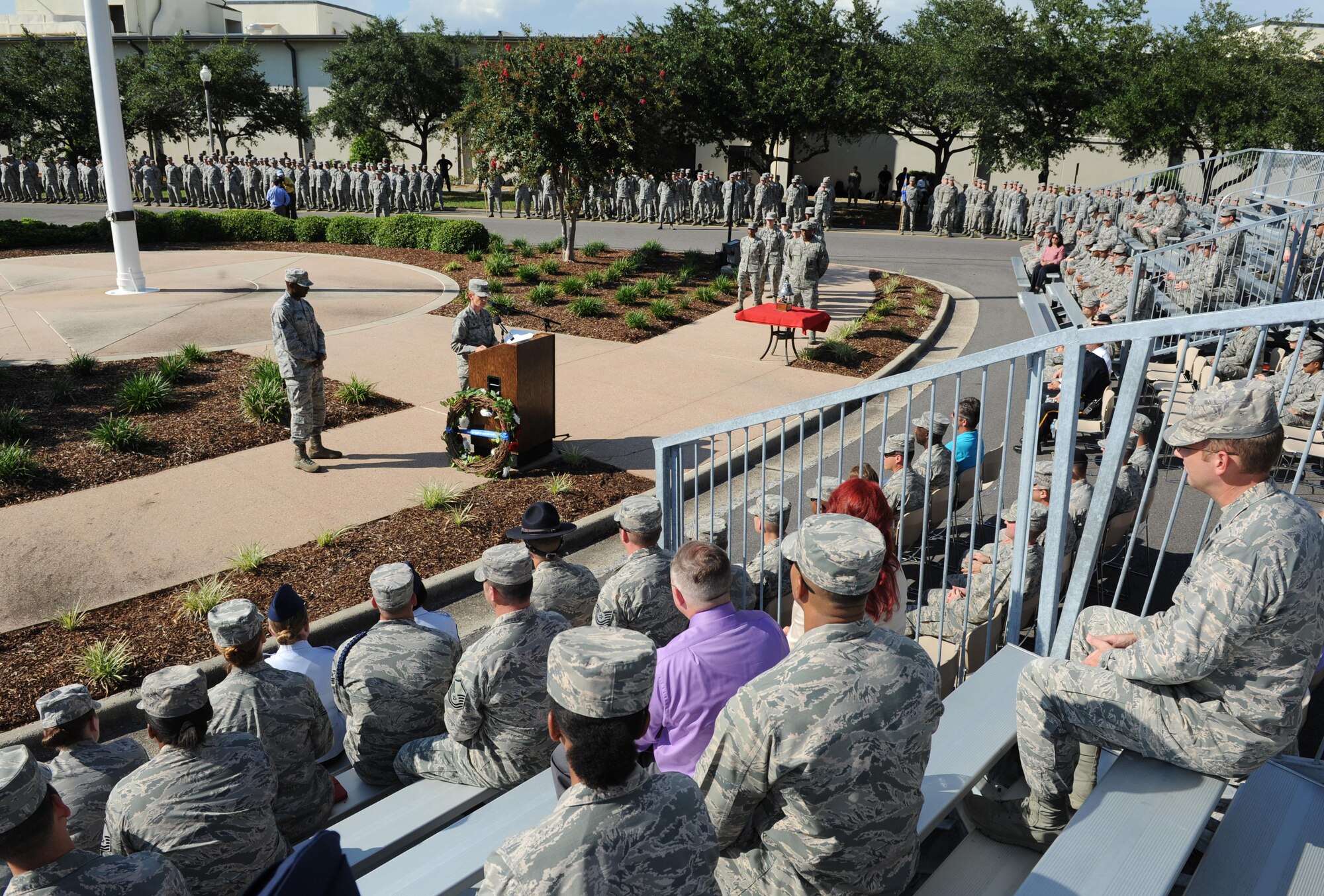 Col. Michele Edmondson, 81st Training Wing commander, delivers remarks during a 9/11 memorial ceremony, Sept. 12, 2016, on Keesler Air Force Base, Miss. Fifteen years ago on Sept. 11, 2001, 19 terrorists simultaneously hijacked four passenger jets; flying one into the Pentagon in Washington, D.C., two into the World Trade Center in New York City, New York and one crashing outside of Shanksville, Pa. A total of 2,996 people were killed in the attacks.  (U.S. Air Force photo by Kemberly Groue/Released)