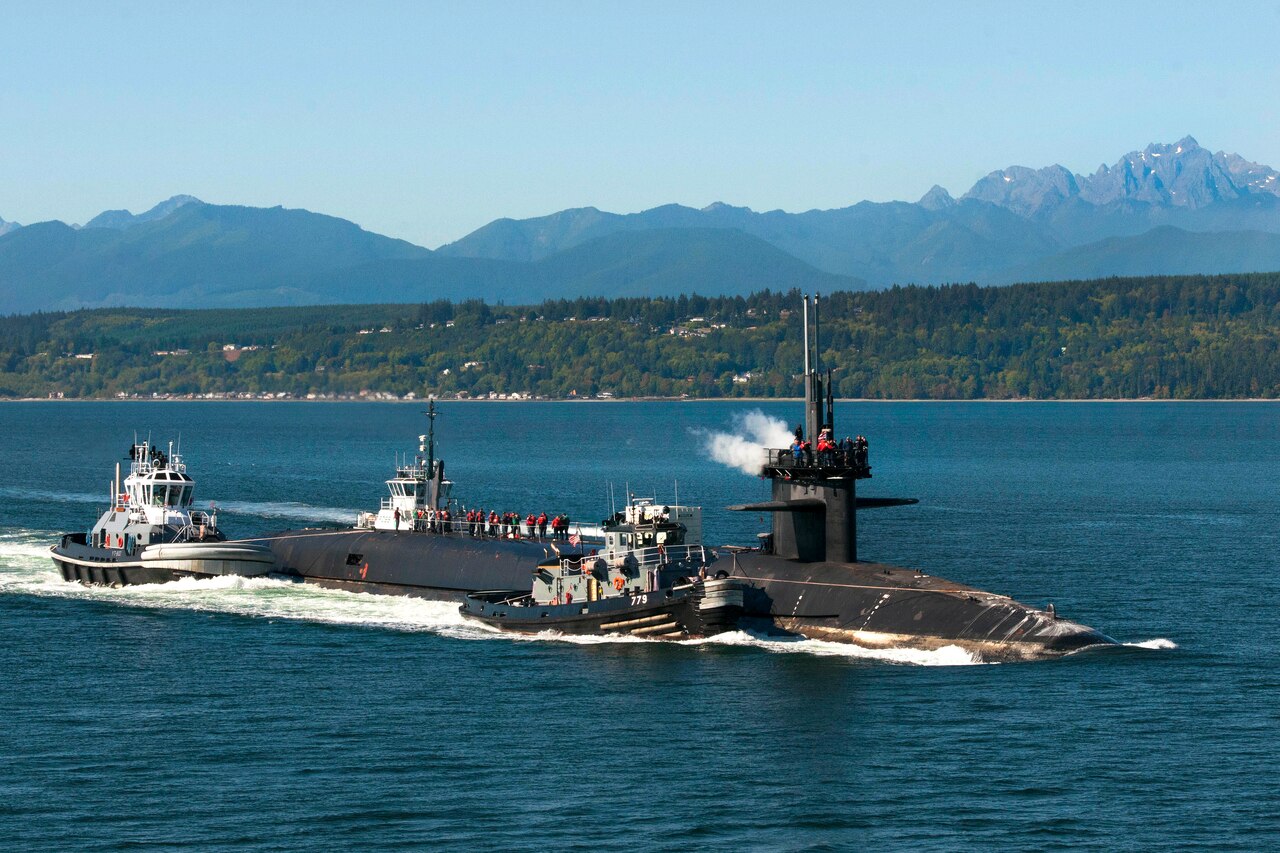Family members ride aboard the Ohio-class ballistic-missile submarine USS Maine as it transits the Hood Canal during a Dependents Cruise in Puget Sound, Wash., Sept. 13, 2016. The submarine is moving from Naval Base Kitsap-Bangor to Puget Sound Naval Shipyard and Intermediate Maintenance Facility to commence an engineered refueling overhaul. Navy photo by Petty Officer 1st Class Amanda R. Gray