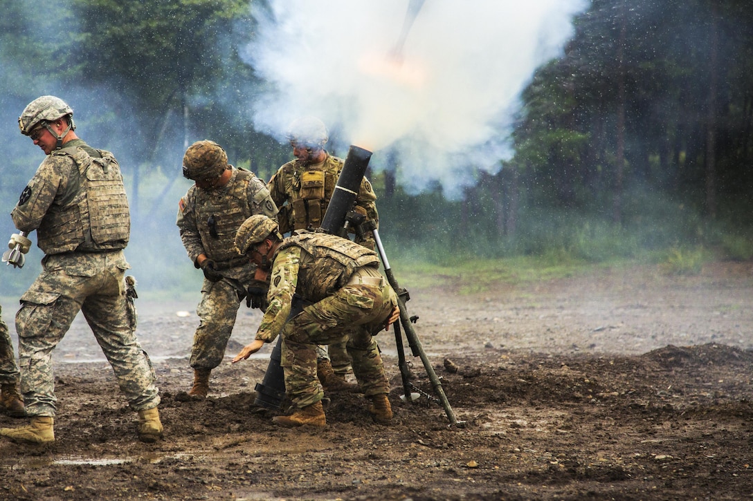 Soldiers fire a battalion mortar system as part of Orient Shield at Aibano Training Area in Shiga, Japan, Sept. 13, 2016. Orient Shield is an annual bilateral training exercise in Japan. Army photo by Spc. Patrick Kirby