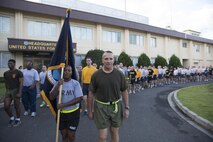 Marine Maj. Gen. Charles Chiarotti, US Forces, Japan commander, and Army 1st Sgt. Donna Cook, USFJ first sergeant, lead for the formation after completing the USFJ Command 5K Run at Yokota Air Base, Japan, Sept. 9, 2016. Over 100 service member participated in the run, which concluded with the retirement of the old USFJ colors and the unveiling of the new USFJ colors. (U.S. Air Force photo by Yasuo Osakabe/Released)