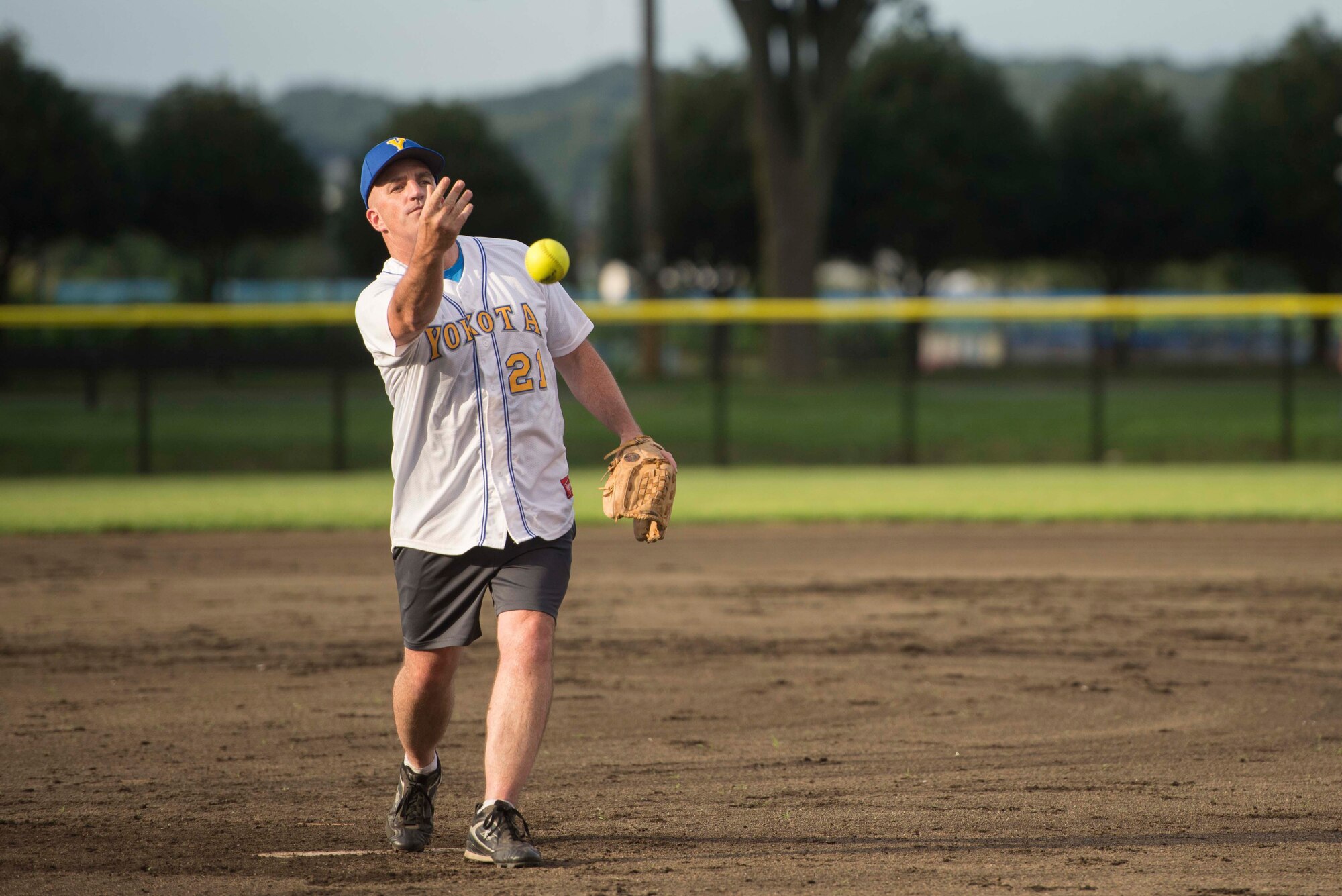 Col. Kenneth Moss, 374th Airlift Wing commander, throws a pitch during a baseball game at Yokota Field, Sept. 9, 2016. Airmen and their families celebrated the field’s opening with food, games and competitive baseball between Yokota’s colonels and chief master sergeants. (U.S. Air Force photo by guy who leaves credit out of his captions)
