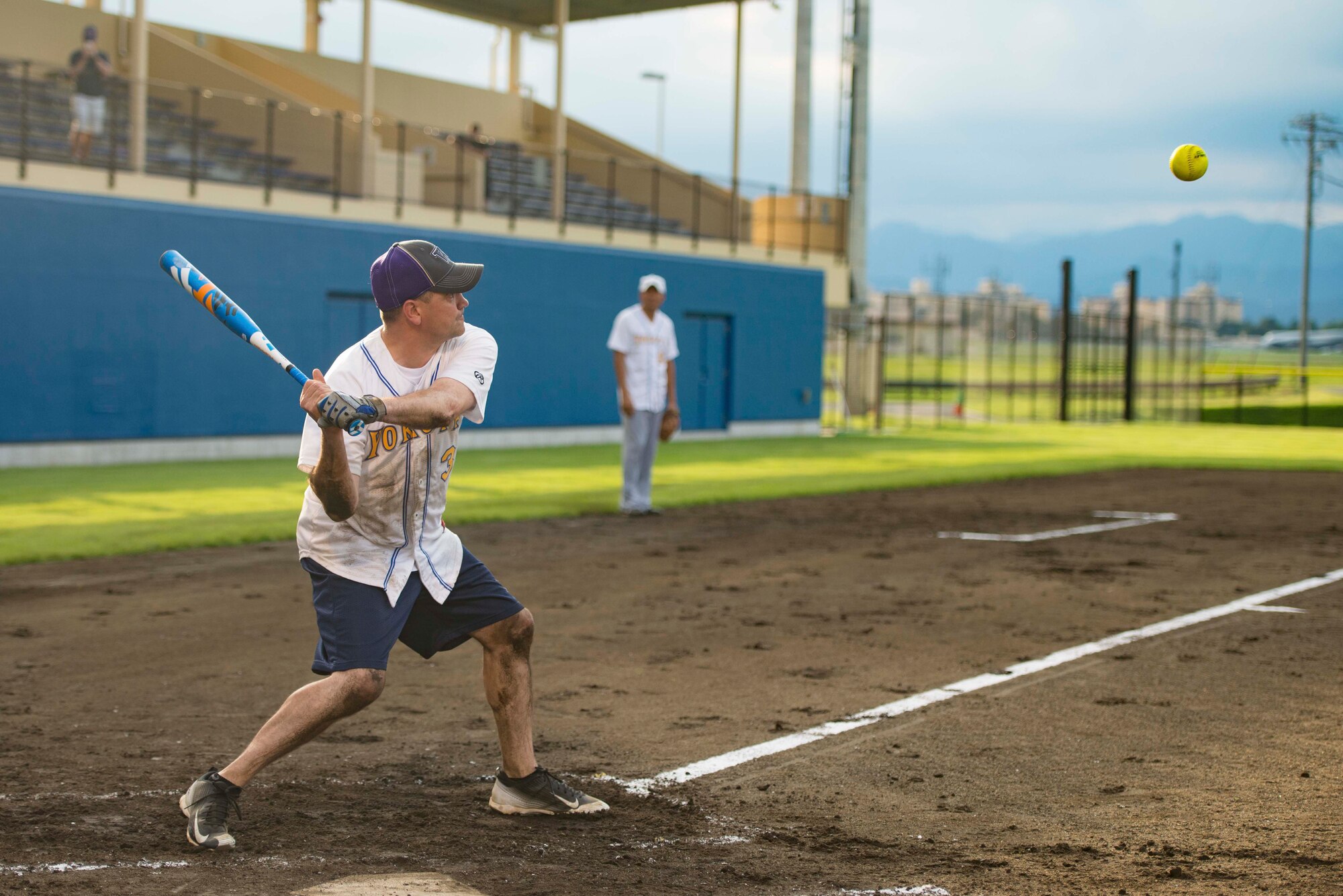 Lt. Col. James Cunningham , 374th Comptroller Squadron commander, swings a bat during a baseball game at Yokota Field, Sept. 9, 2016. Airmen and their families celebrated the field’s opening with food, games and competitive baseball between Yokota’s colonels and chief master sergeants. (U.S. Air Force photo by guy who leaves credit out of his captions)