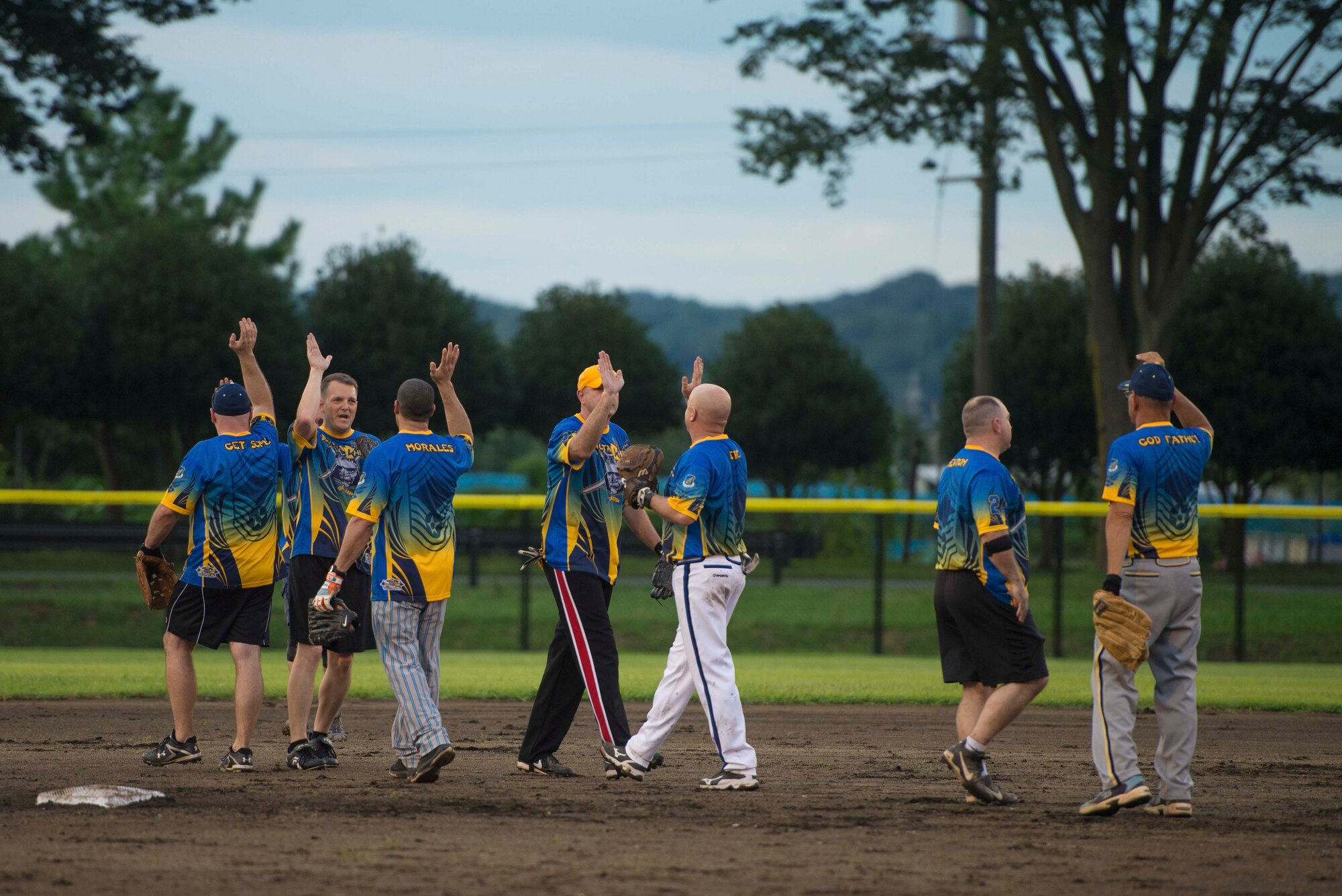 The Yokota Chiefs celebrate their victory over the Eagles at Yokota Field stadium, Sept. 9, 2016. Yokota commanders and chief master sergeants hosted a baseball game to celebrate the opening of the field. (U.S. Air Force by Senior Airman Delano Scott/Released)