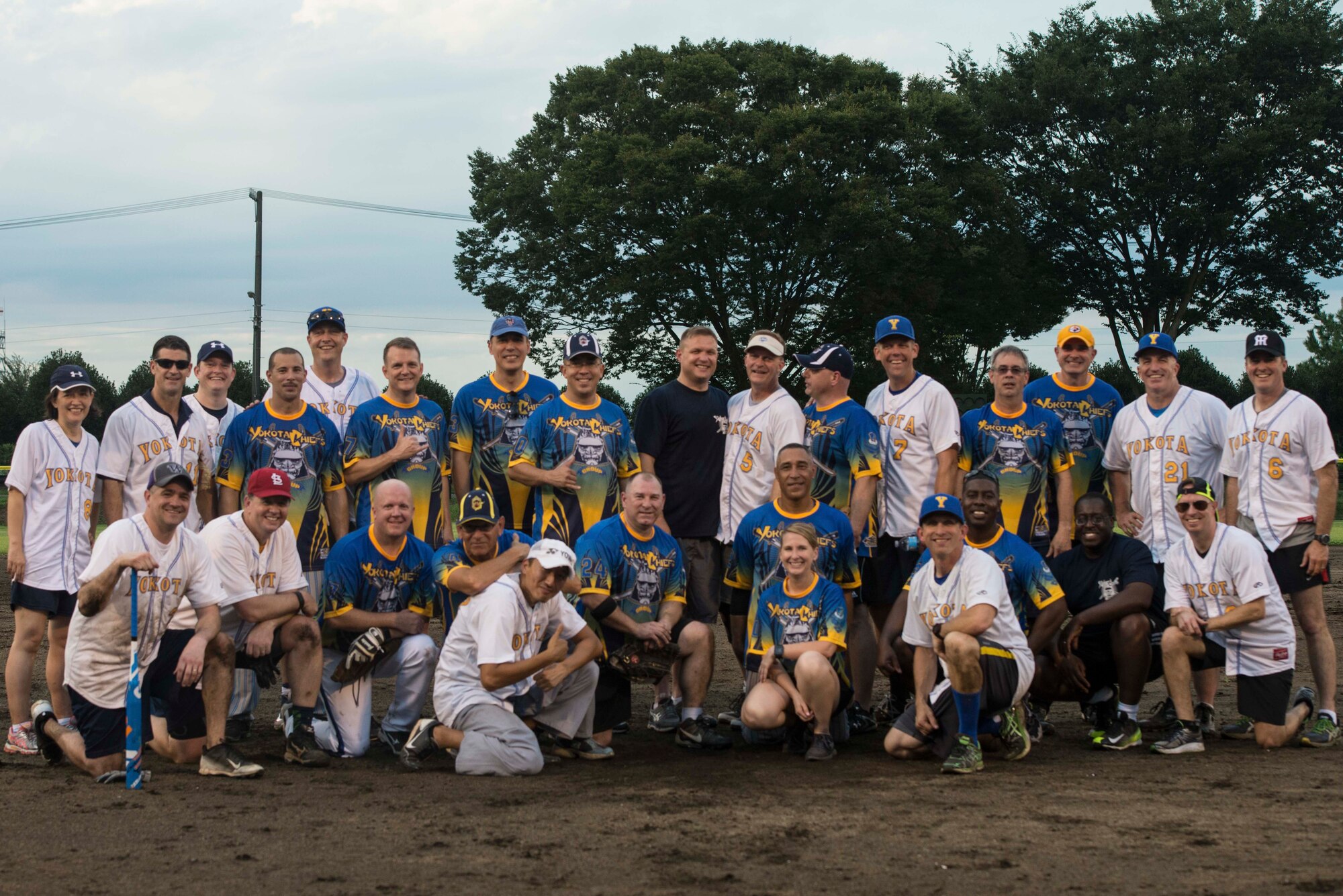 Yokota commanders and chief master sergeants pose for a group photo after a baseball game at Yokota Field, Sept. 9, 2016. The game was an opportunity for Airmen and their families to celebrate the field’s opening with food, games and competitive fun. (U.S. Air Force by Senior Airman Delano Scott/Released)
