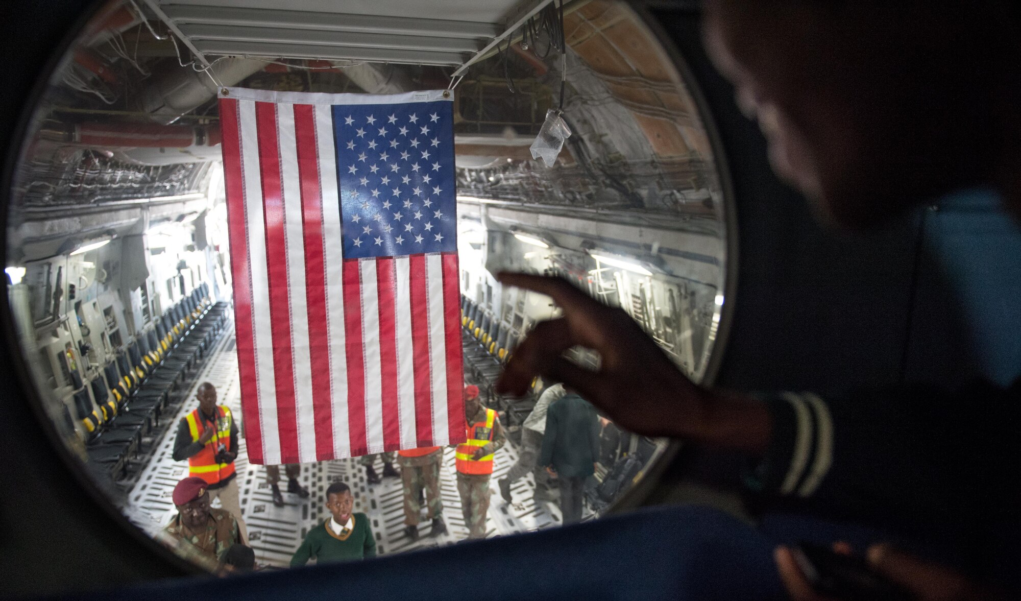 A South African student explores the view of a C-17 Globemaster III from the crew deck of the aircraft at the African Aerospace and Defense Expo at Waterkloof Air Force Base, South Africa, Sept. 14, 2016. The U.S. military is exhibiting a C-17 Globemaster III, a KC-135 Stratotanker, a C-130J Super Hercules, an HC-130 King, and an MQ-9 Reaper. The aircraft come from various Air National Guard and Air Force Reserve Command units. The U.S. routinely participates in events like AADE to strengthen partnerships with regional partners. (U.S. Air Force photo by Tech. Sgt. Ryan Crane)