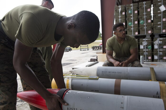 U.S. Aviation Ordnance Marines with Marine Aviation Logistics Squadron12 prepare ordnance for aviation squadrons participating in Valiant Shield 16 at Andersen Air Force Base, Guam, September 12, 2016. The ordnance constructed, provided the Marines of MALS-12 valuable experience assembling live ordnance to be used  during VS16 for a ship sinking exercise. VS16 is a biennial U.S. only, field training exercise that focuses on joint training with U.S. Navy, Air Force and Marine Corps to increase interoperability and working relationships. (U.S. Marine Corps photo by Sgt. Justin A. Fisher)
