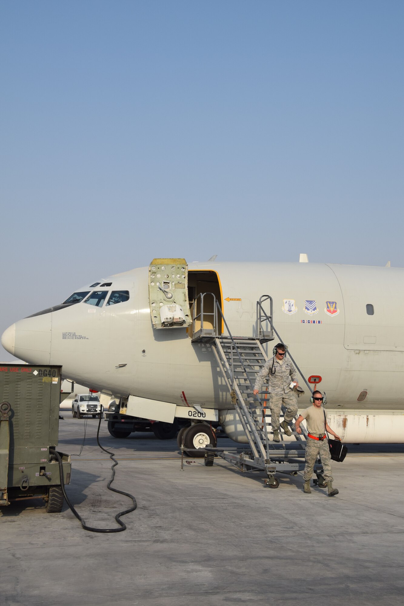 Crew chiefs from the 7th Expeditionary Air Mobility Unit exit a E-8C Joint Surveillance Target Attack Radar System prior to a mission on Sept. 12, 2016, at Al Udeid Air Base, Qatar. The JSTARS uses its communicaiton and radar systems support ground units and direct air support throughout the area of responisbility. (U.S. Air Force photo/Tech. Sgt. Carlos J. Trevino/Released)